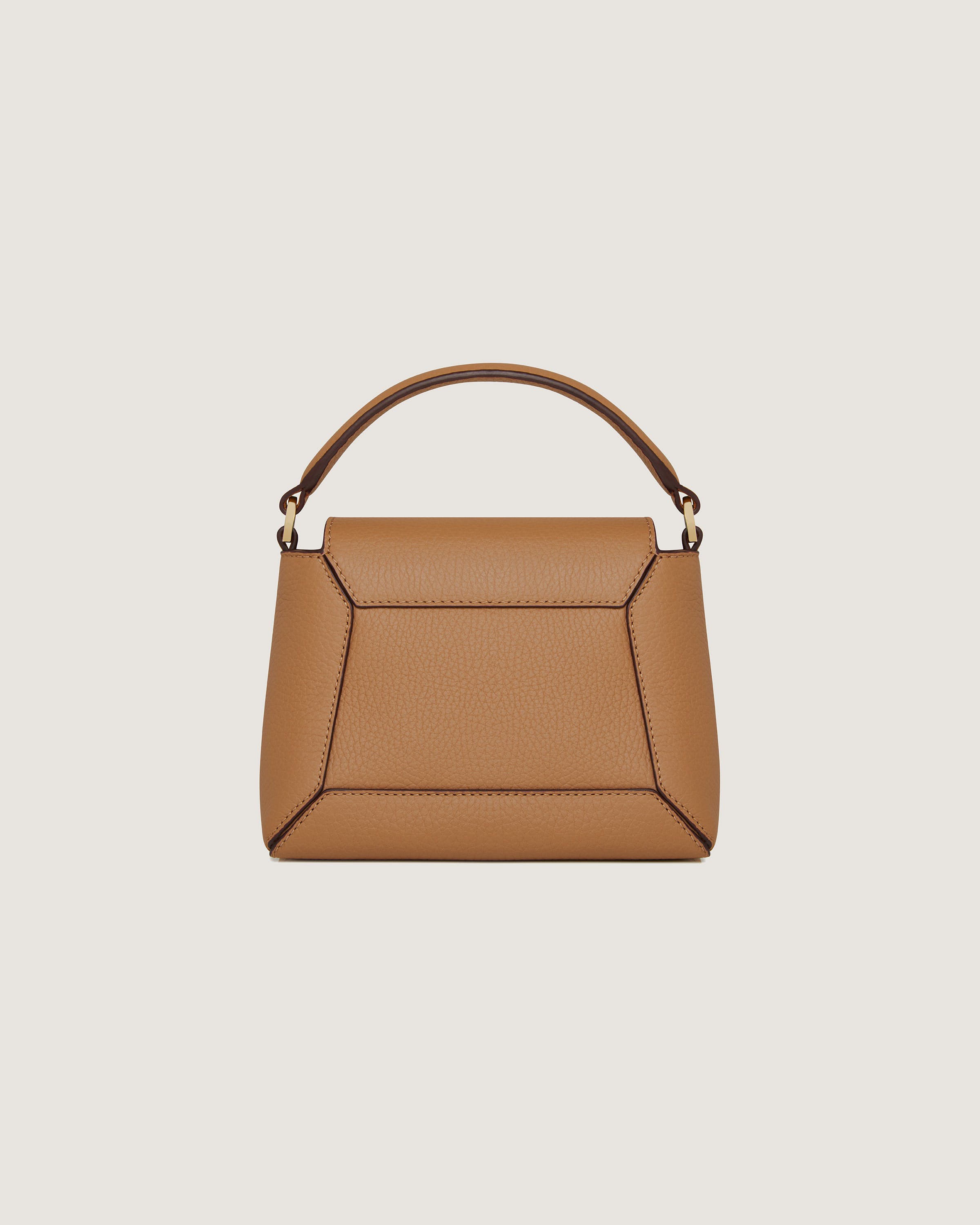 A brown handbag with a handle on a white background