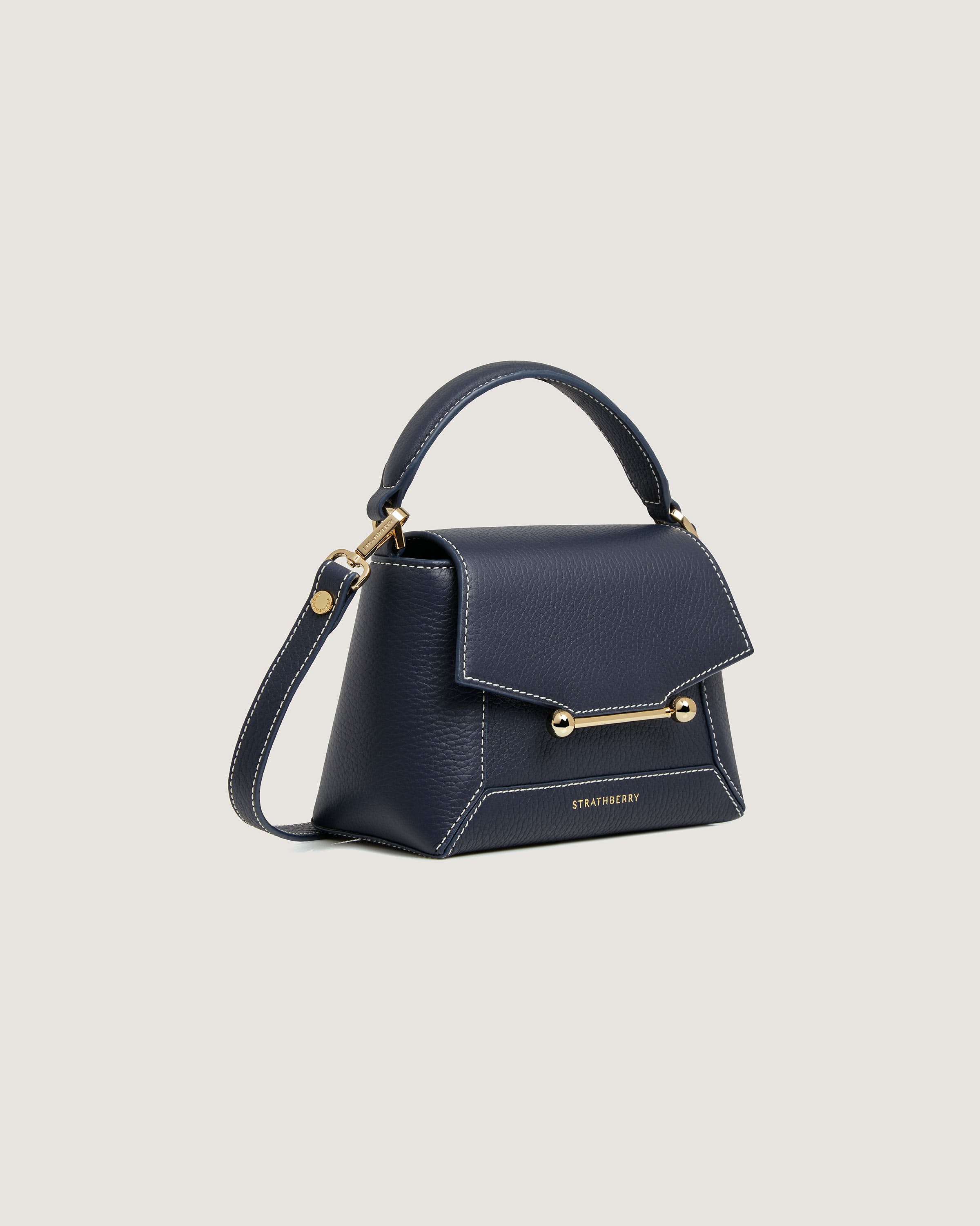 A small blue handbag with a gold handle