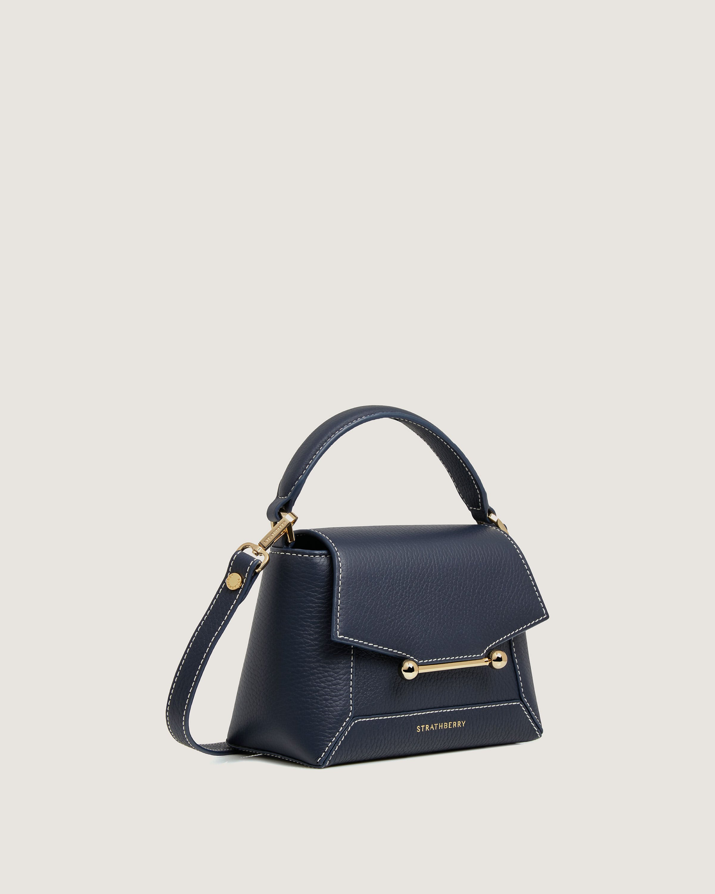 A small blue handbag with a gold handle