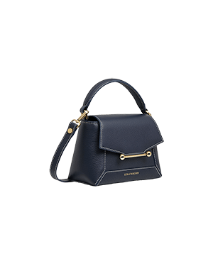 A blue handbag with a gold handle