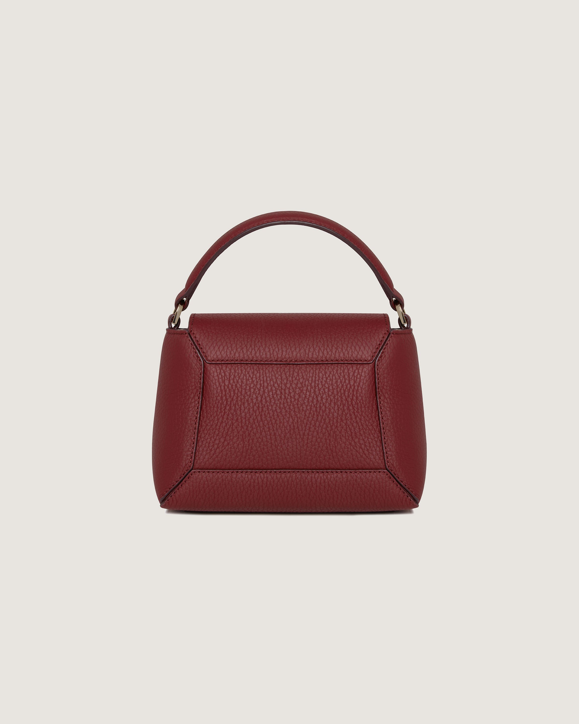 A red handbag with a handle on a white background