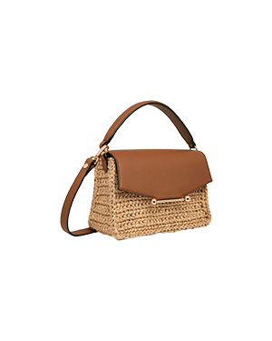 A straw bag with a brown leather handle