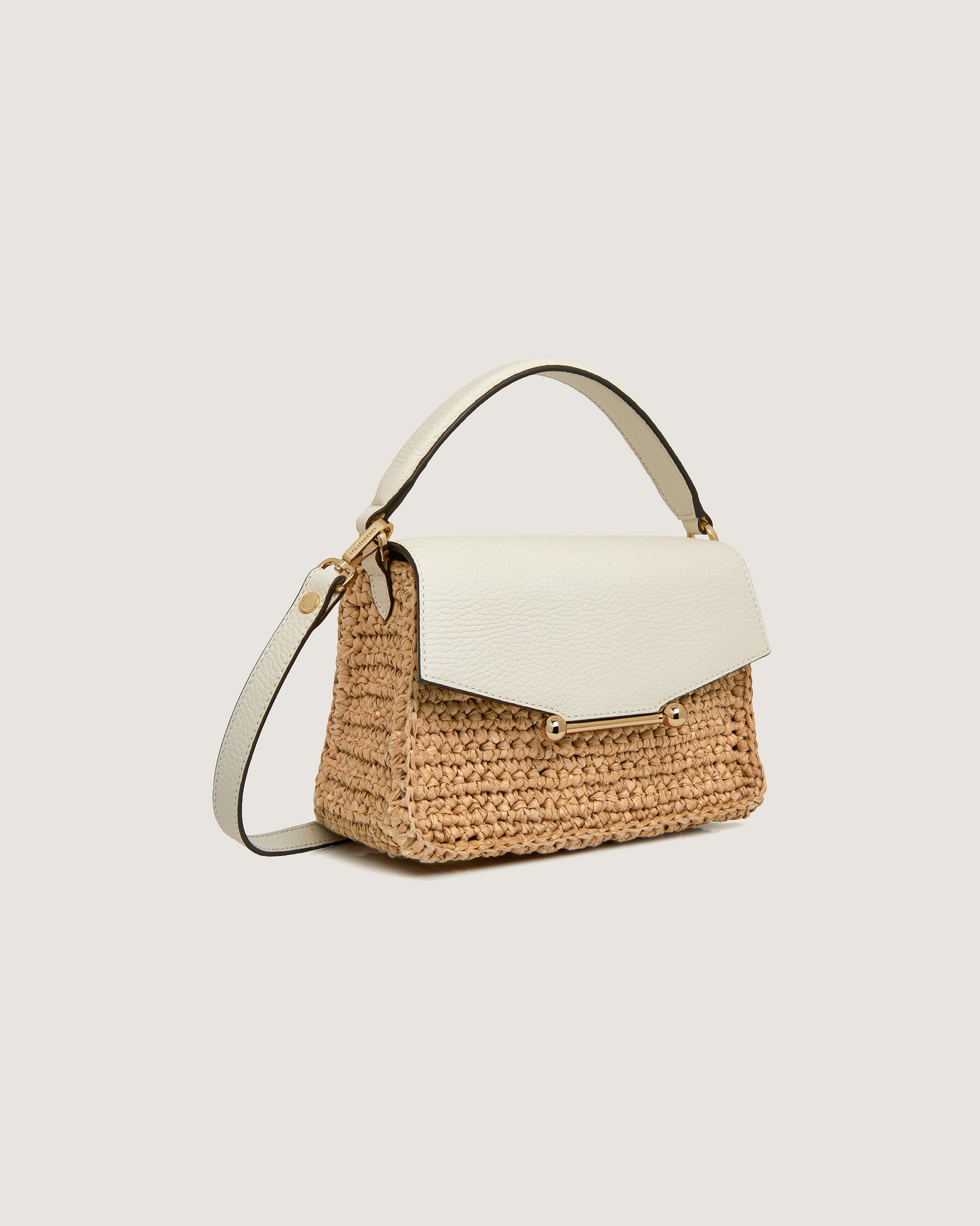 A white and beige handbag with a handle