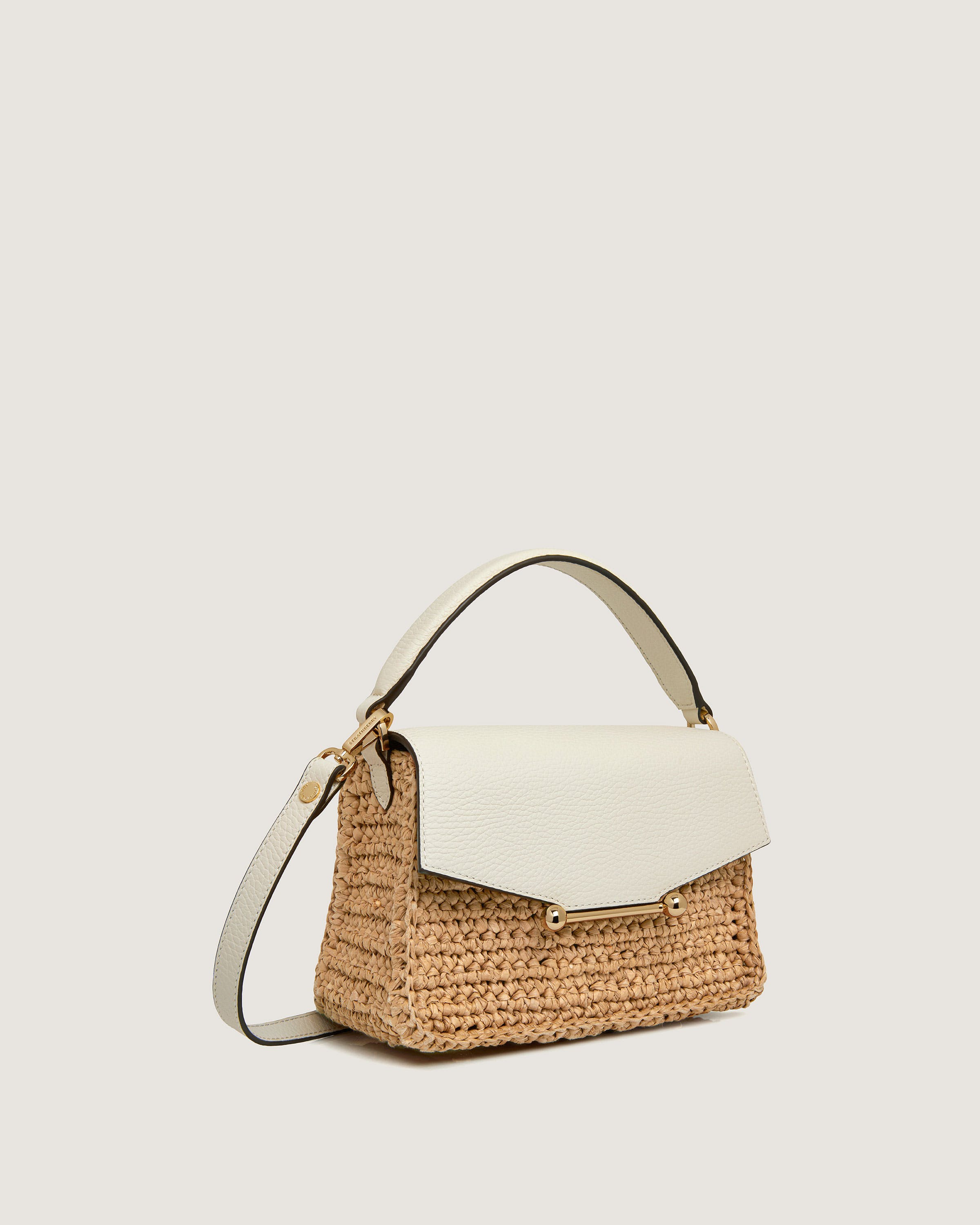 A white and beige handbag with a handle