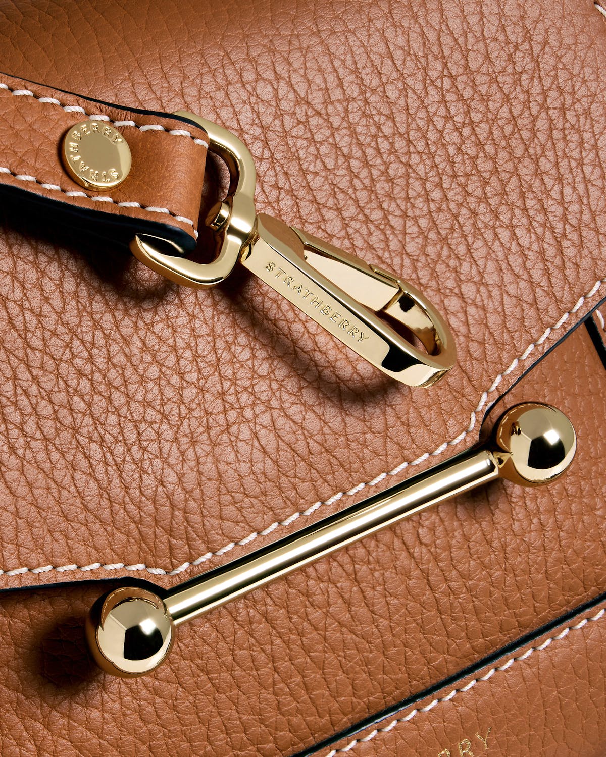 A close up of a brown purse on a table