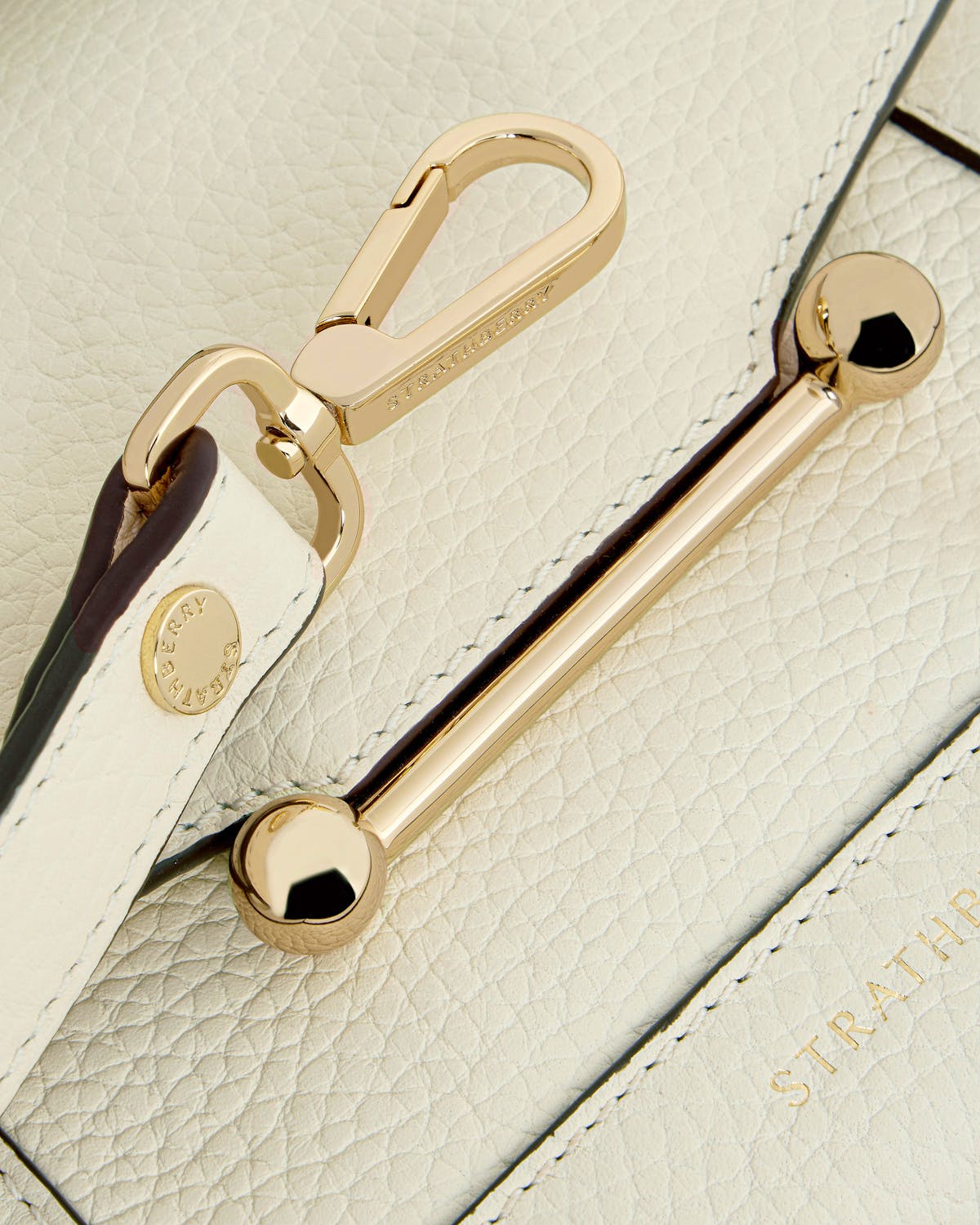 Strathberry Mosaic Nano bag in vanilla with gold bar closure and clasp