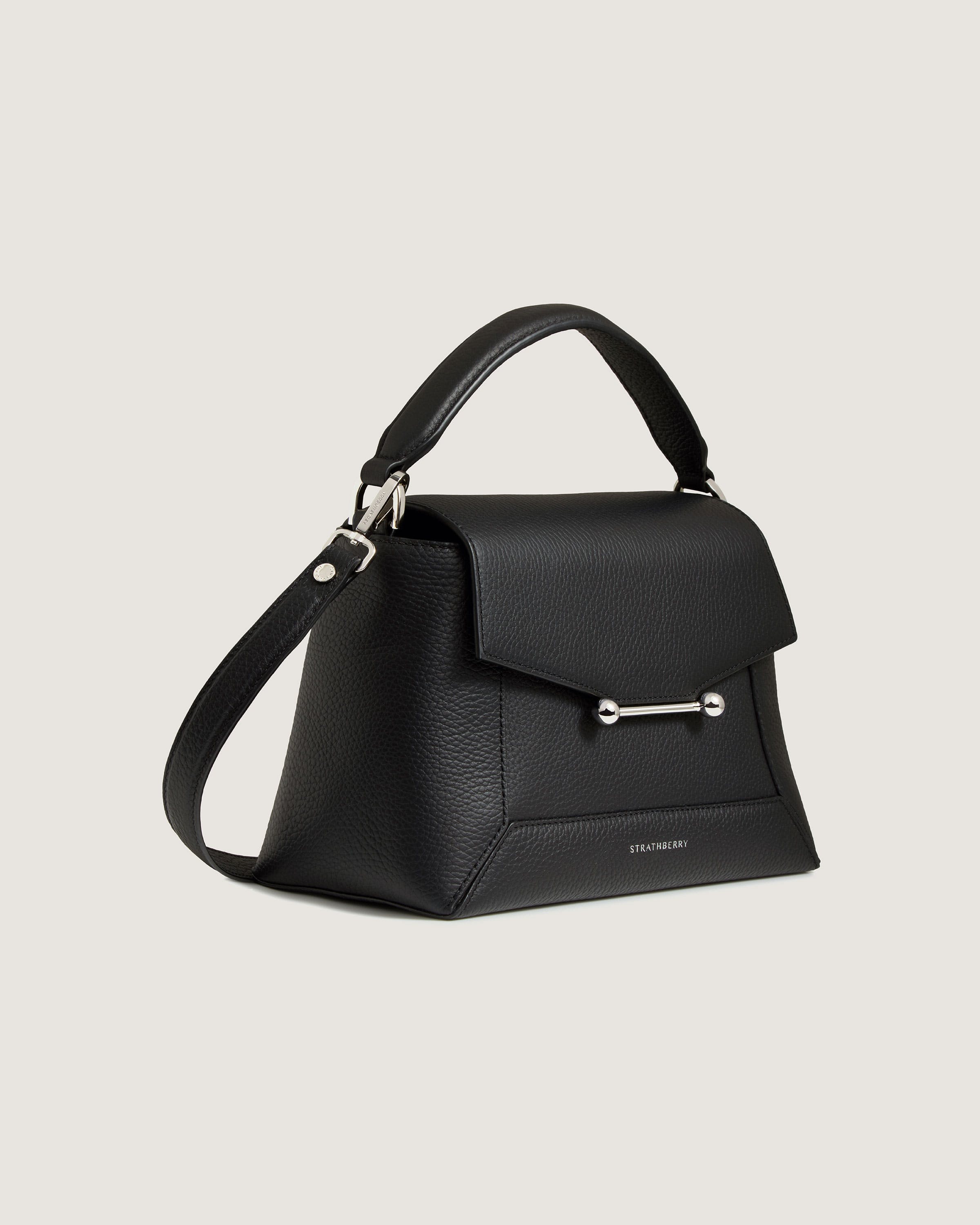 A black handbag with a metal handle