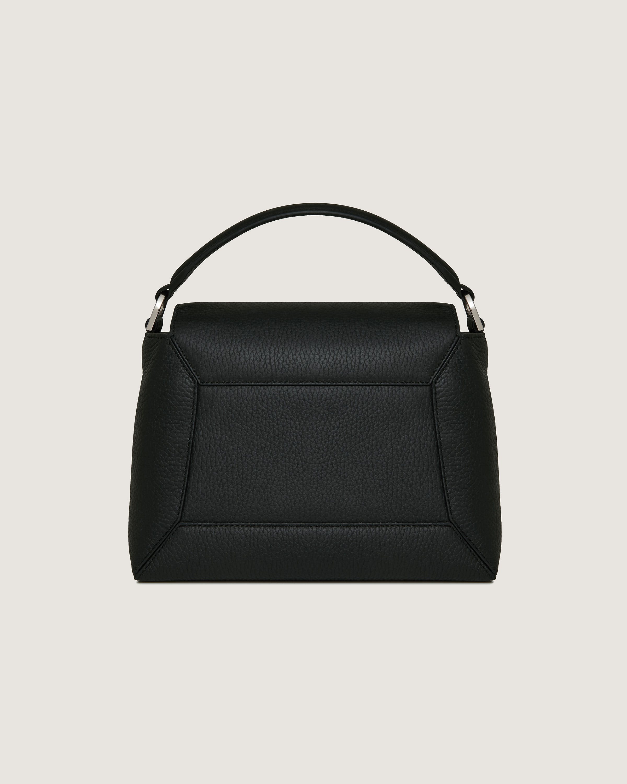 A black handbag on a white background