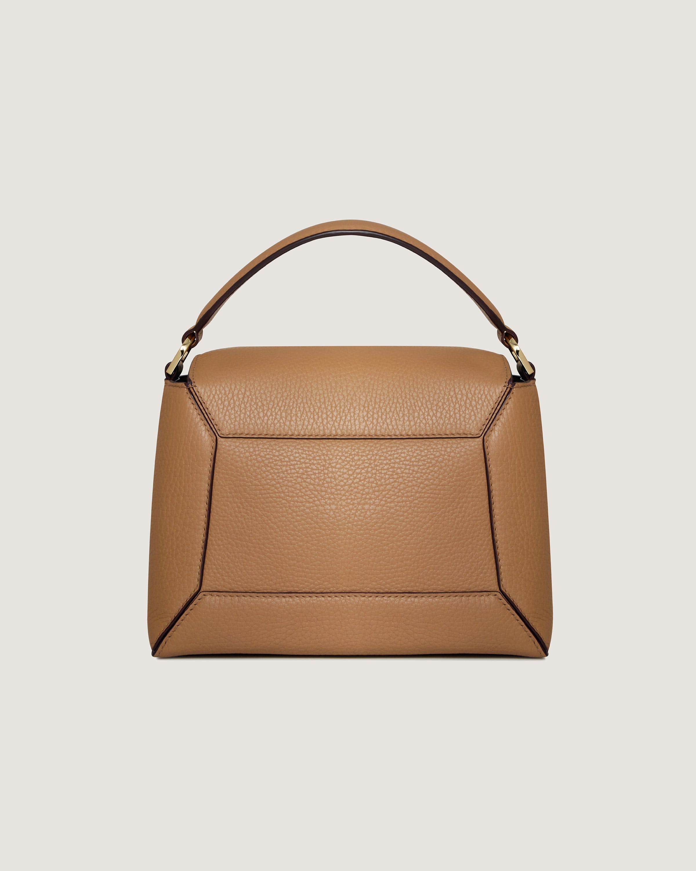 A brown handbag with a handle on a white background