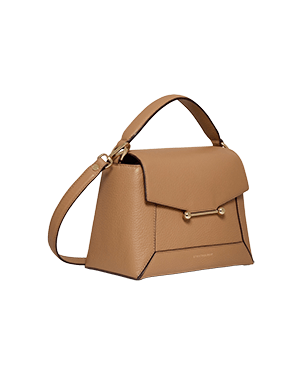 A tan handbag with a shoulder strap