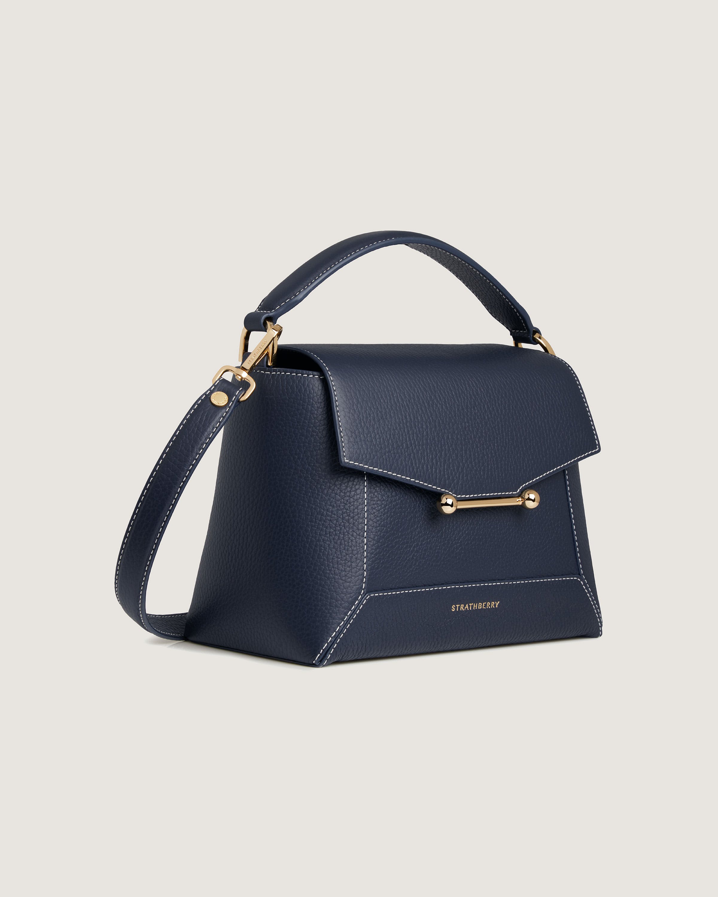 A small blue handbag with a gold handle