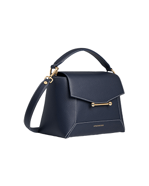 A blue handbag with a gold handle