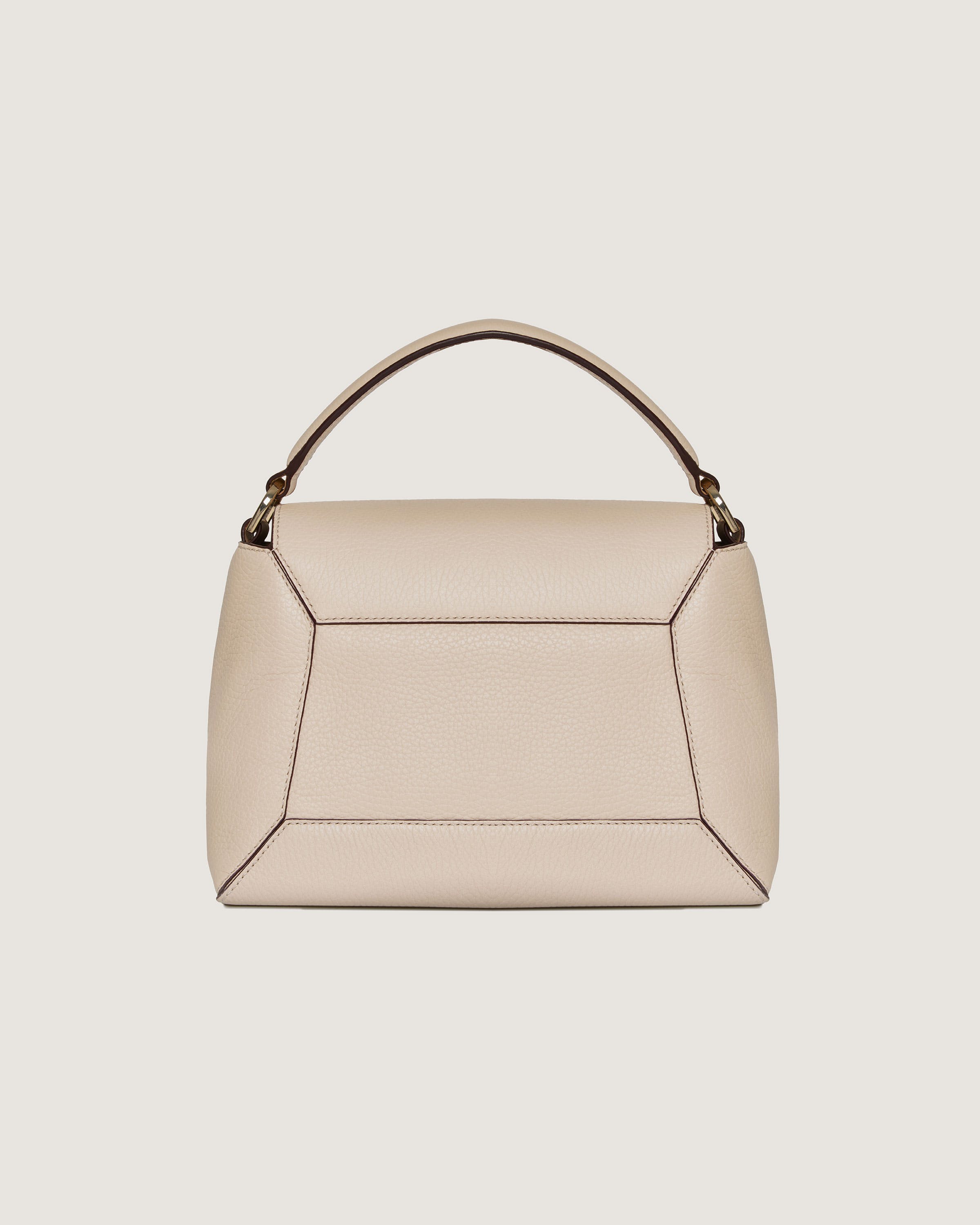 A beige handbag with a curved handle