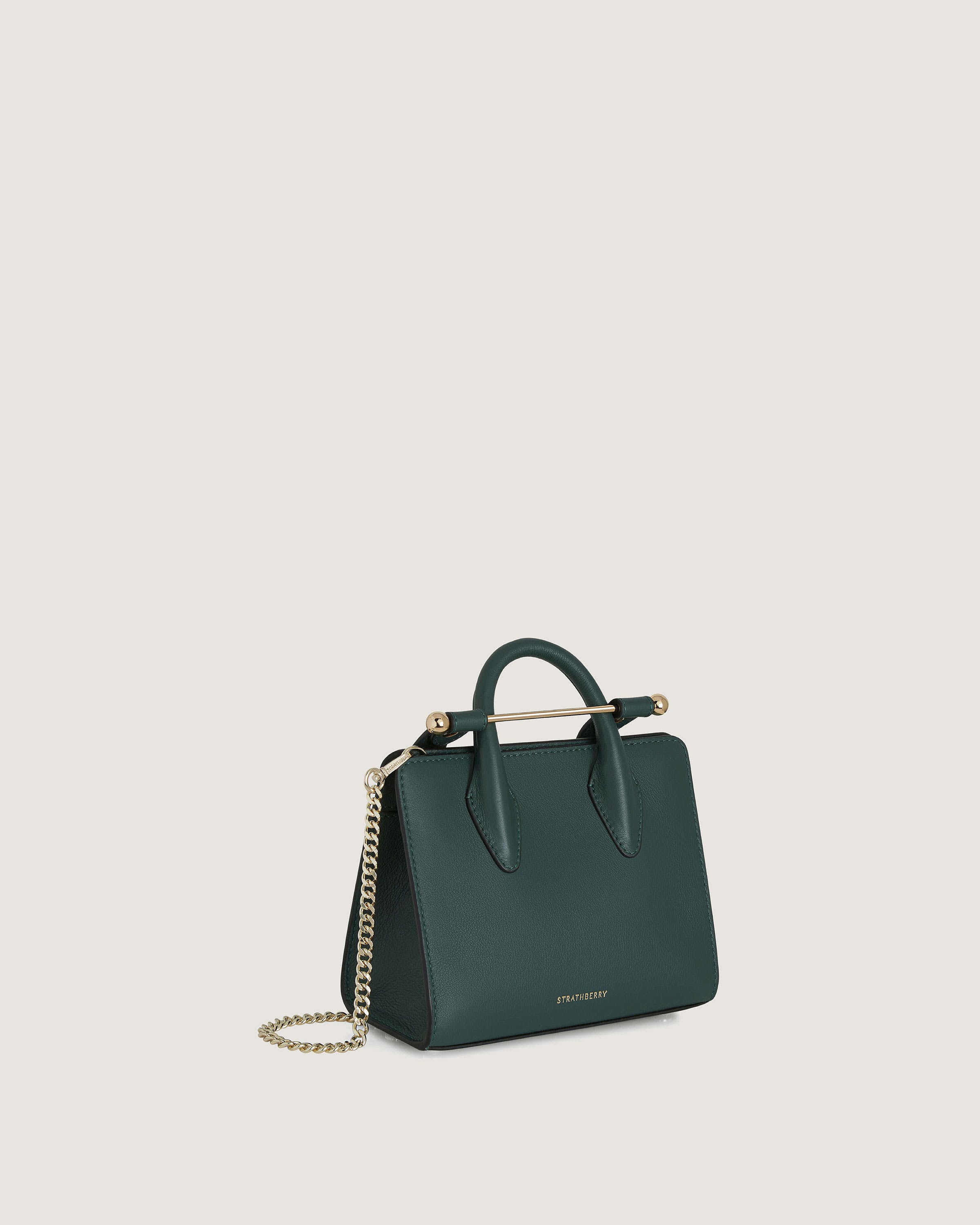 A green handbag with a gold chain