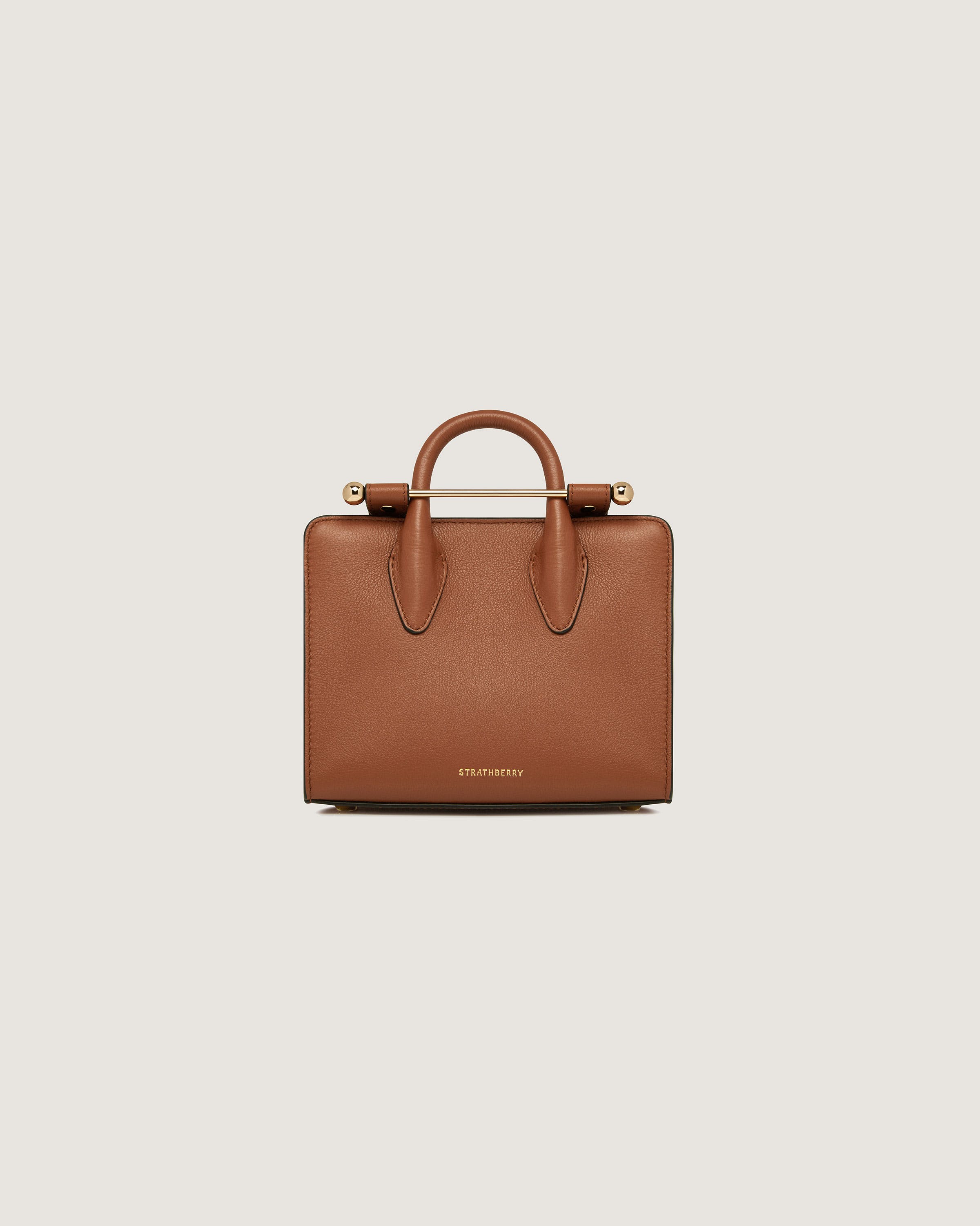 A brown handbag on a white background