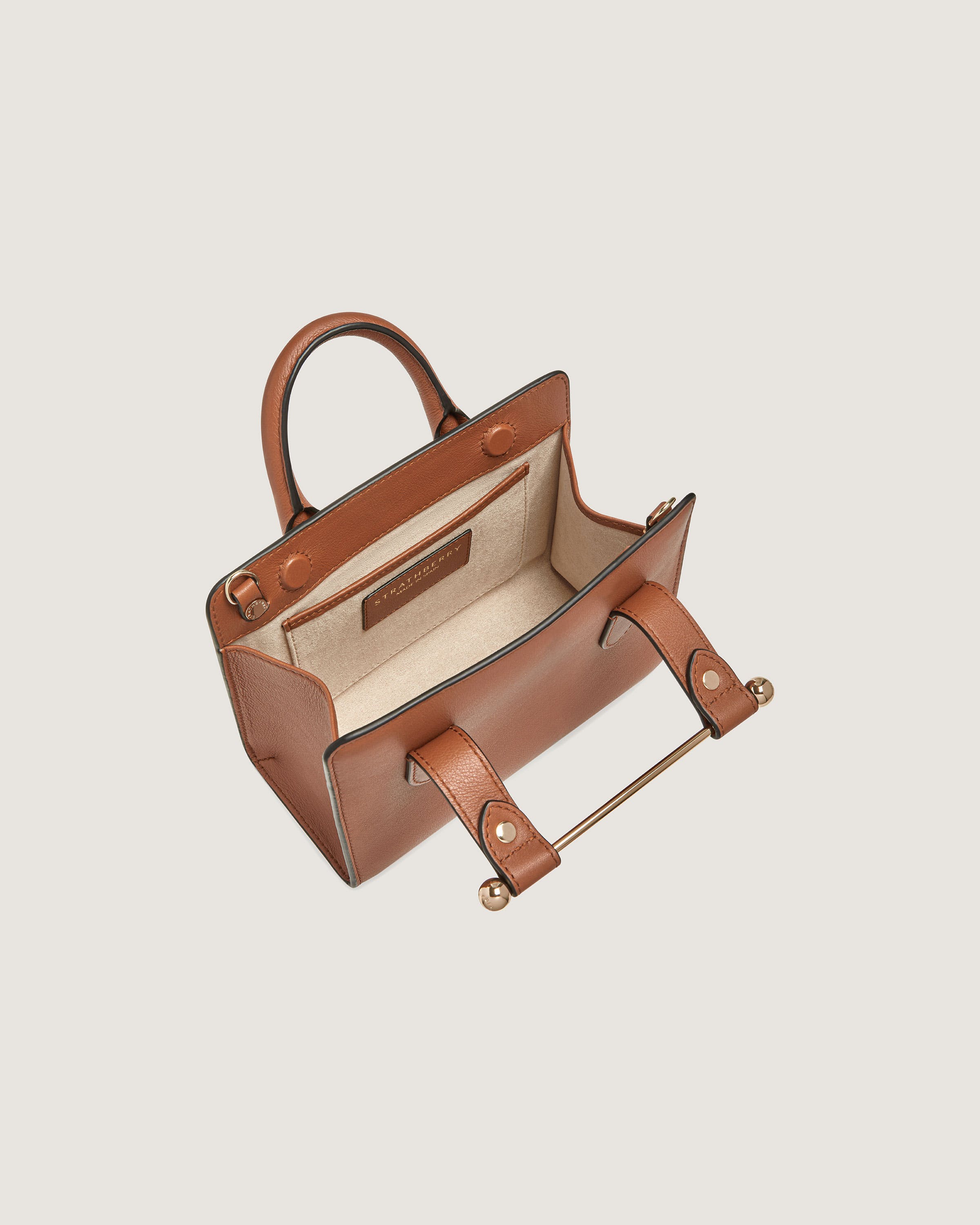 A brown leather handbag with a handle