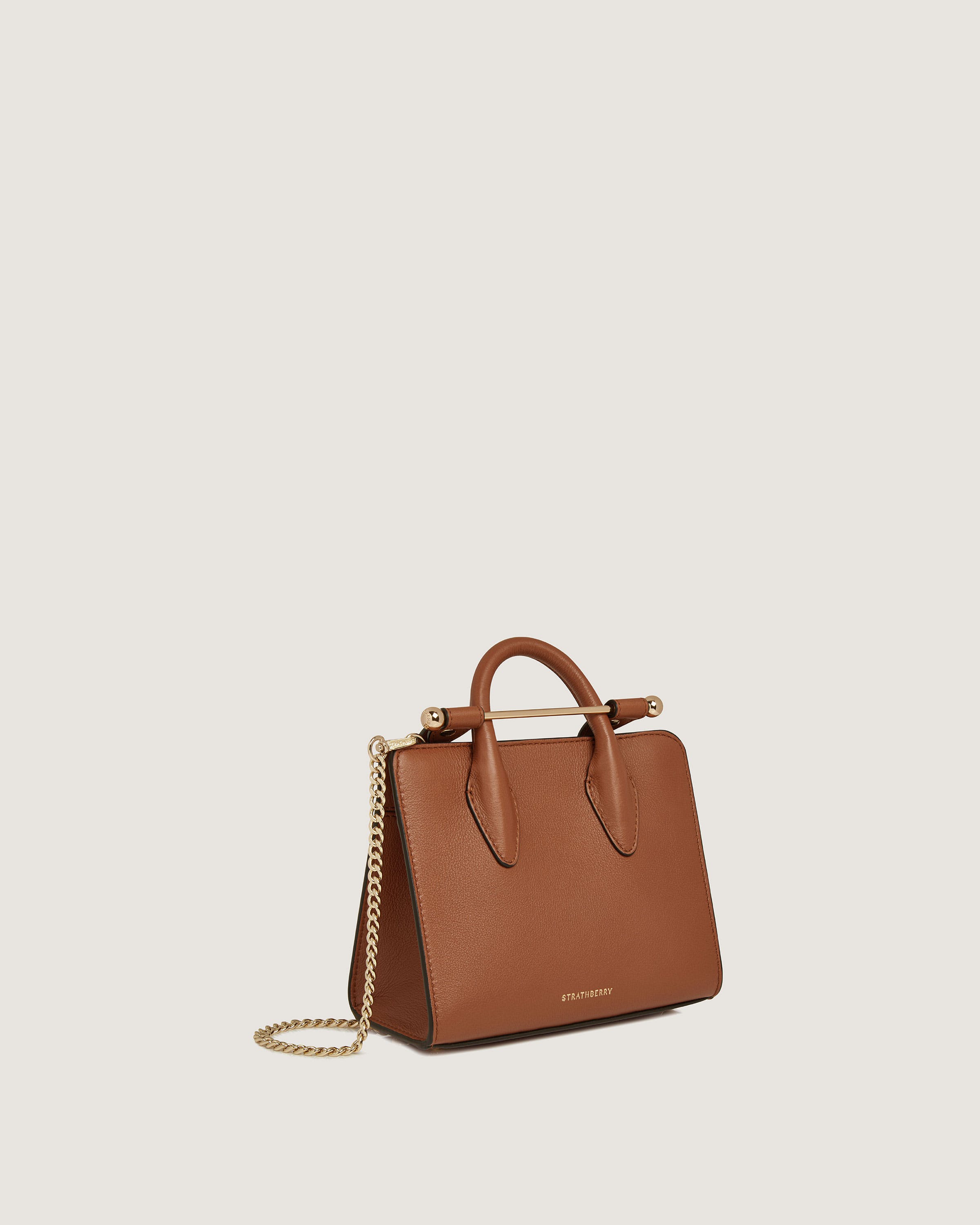 A brown handbag with a gold chain