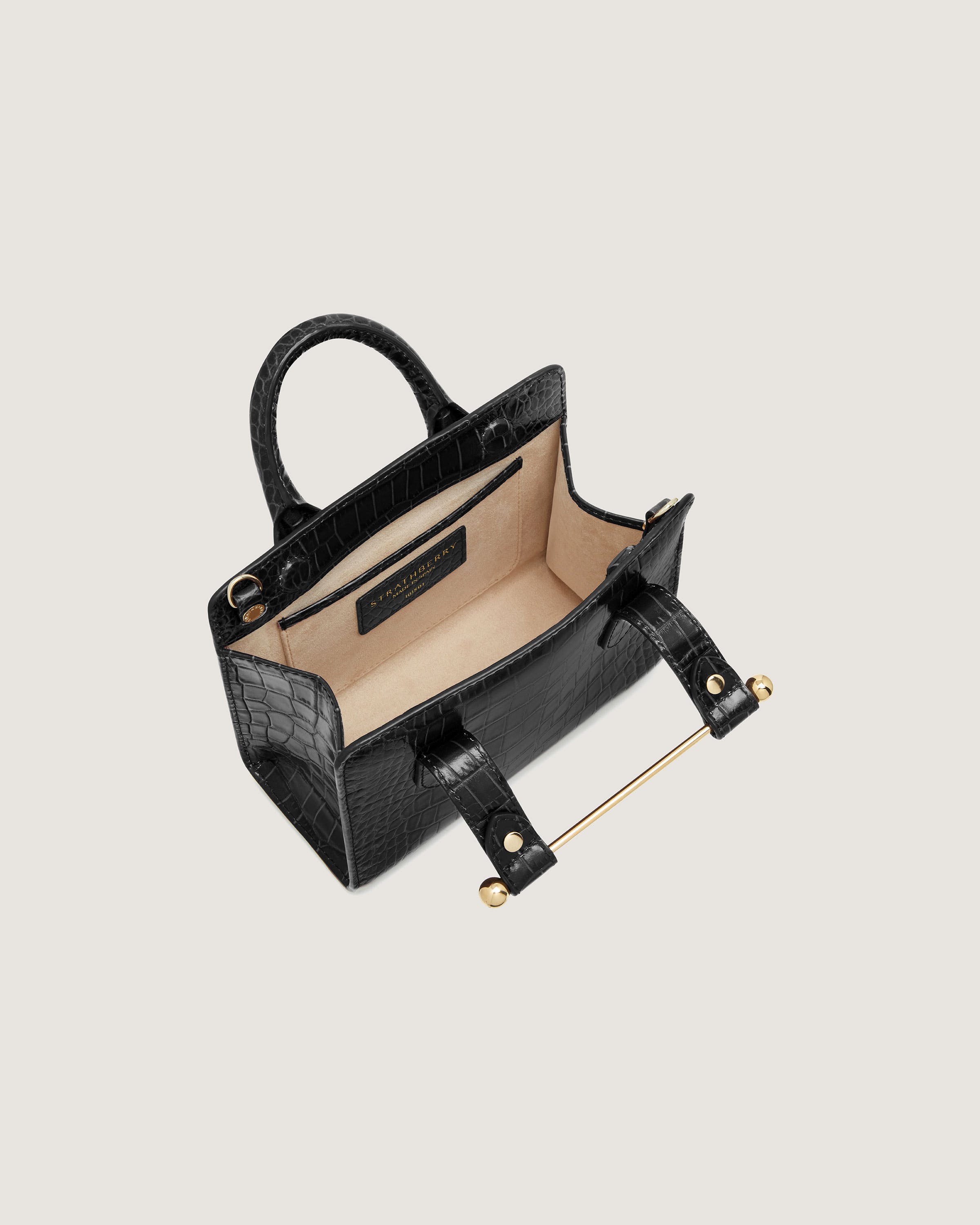 A black handbag on a white background