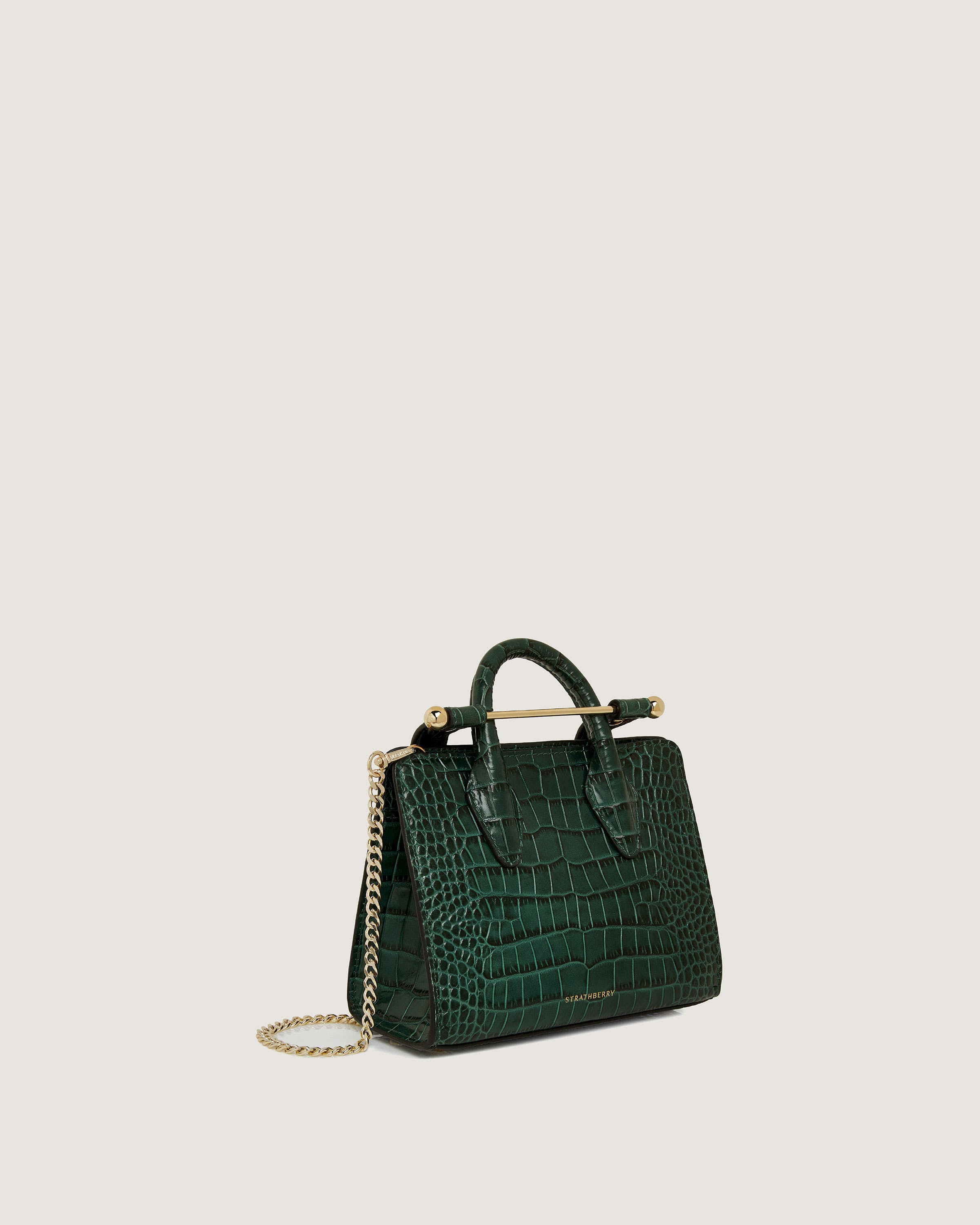 A green handbag with a chain strap