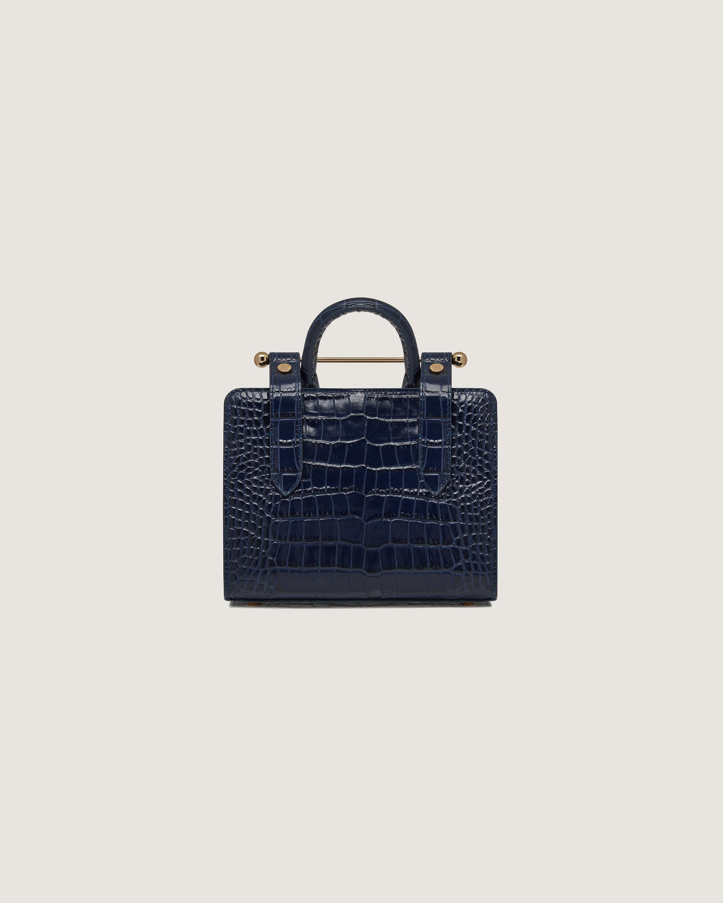 A small blue alligator - embossed leather bag