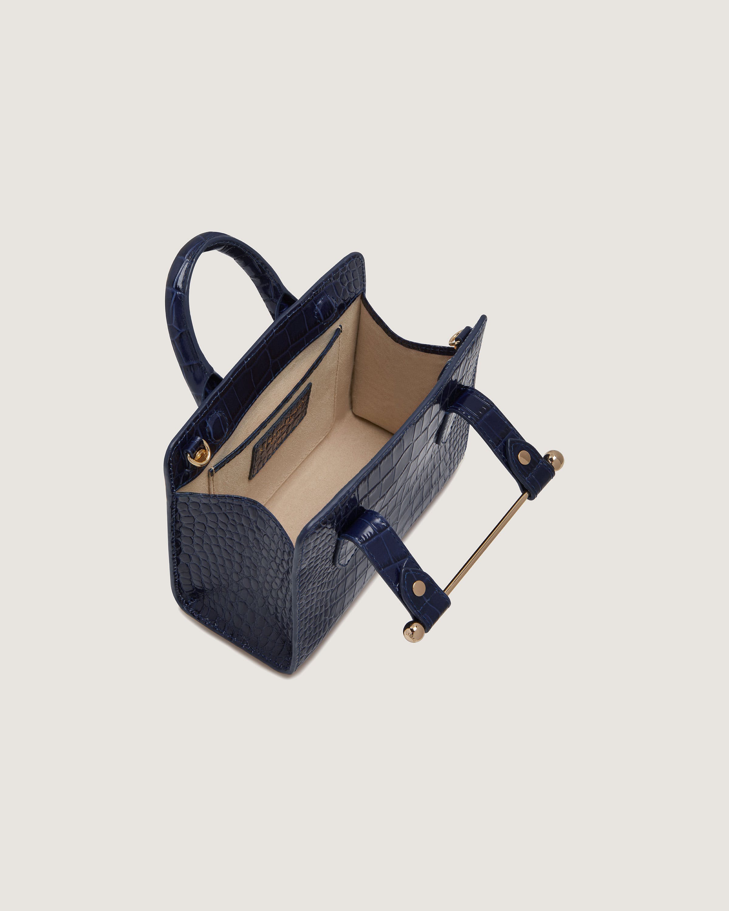 A blue handbag with handles and a handle