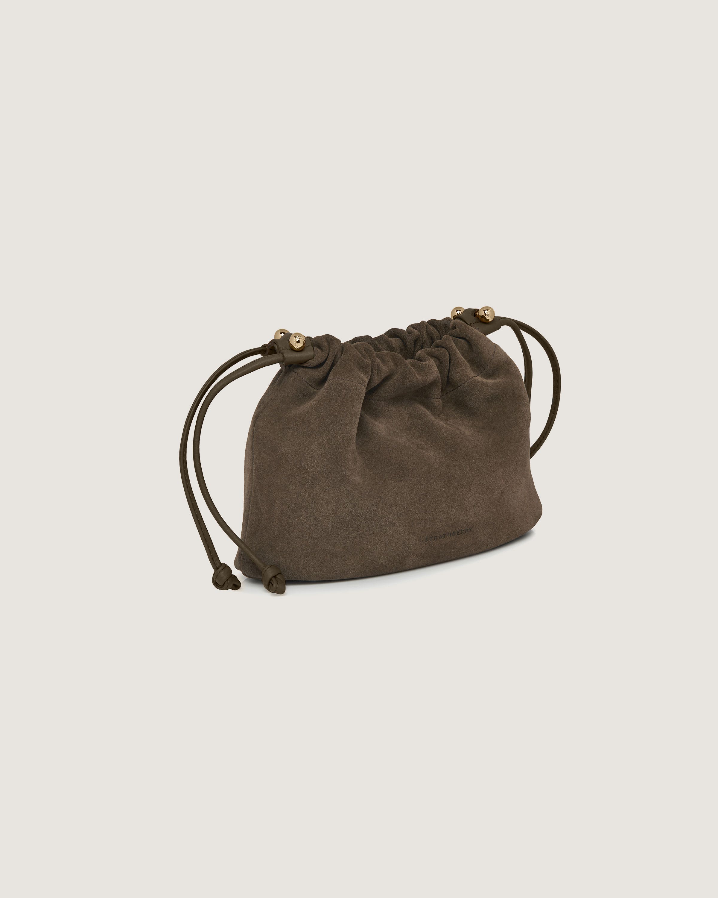 A small brown bag with a drawstring strap