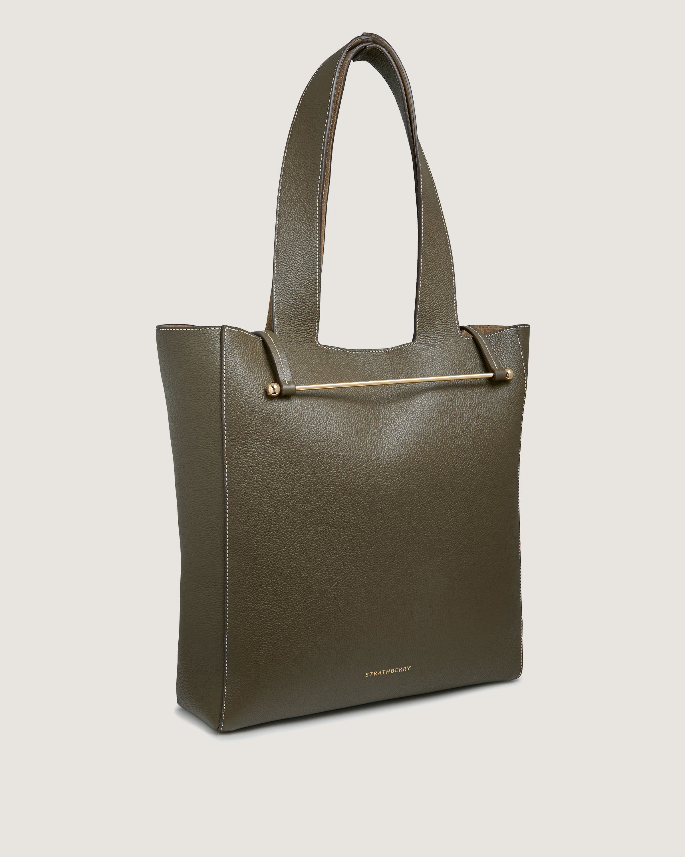 A green leather tote bag on a white background