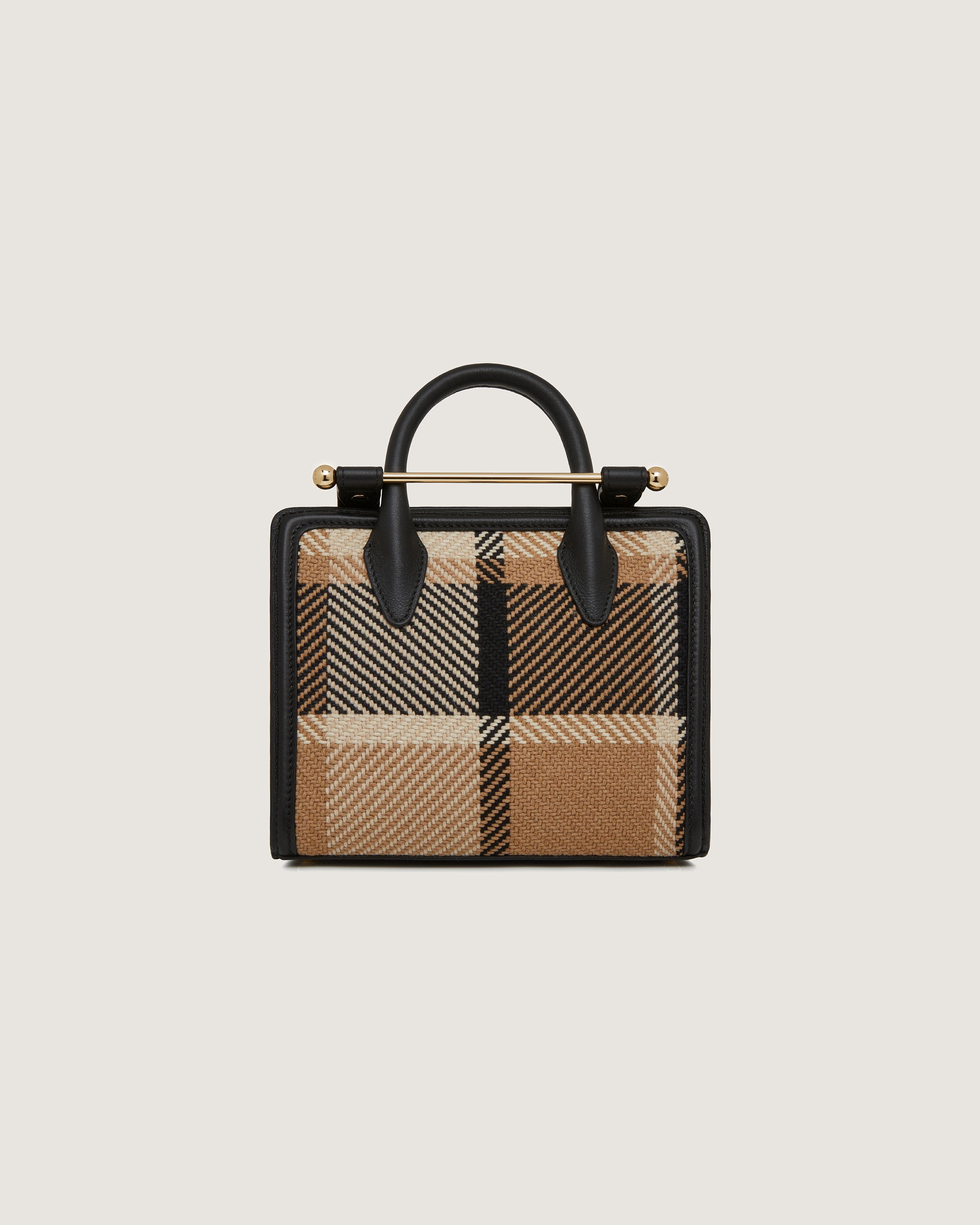 A brown and black checkered handbag on a white background