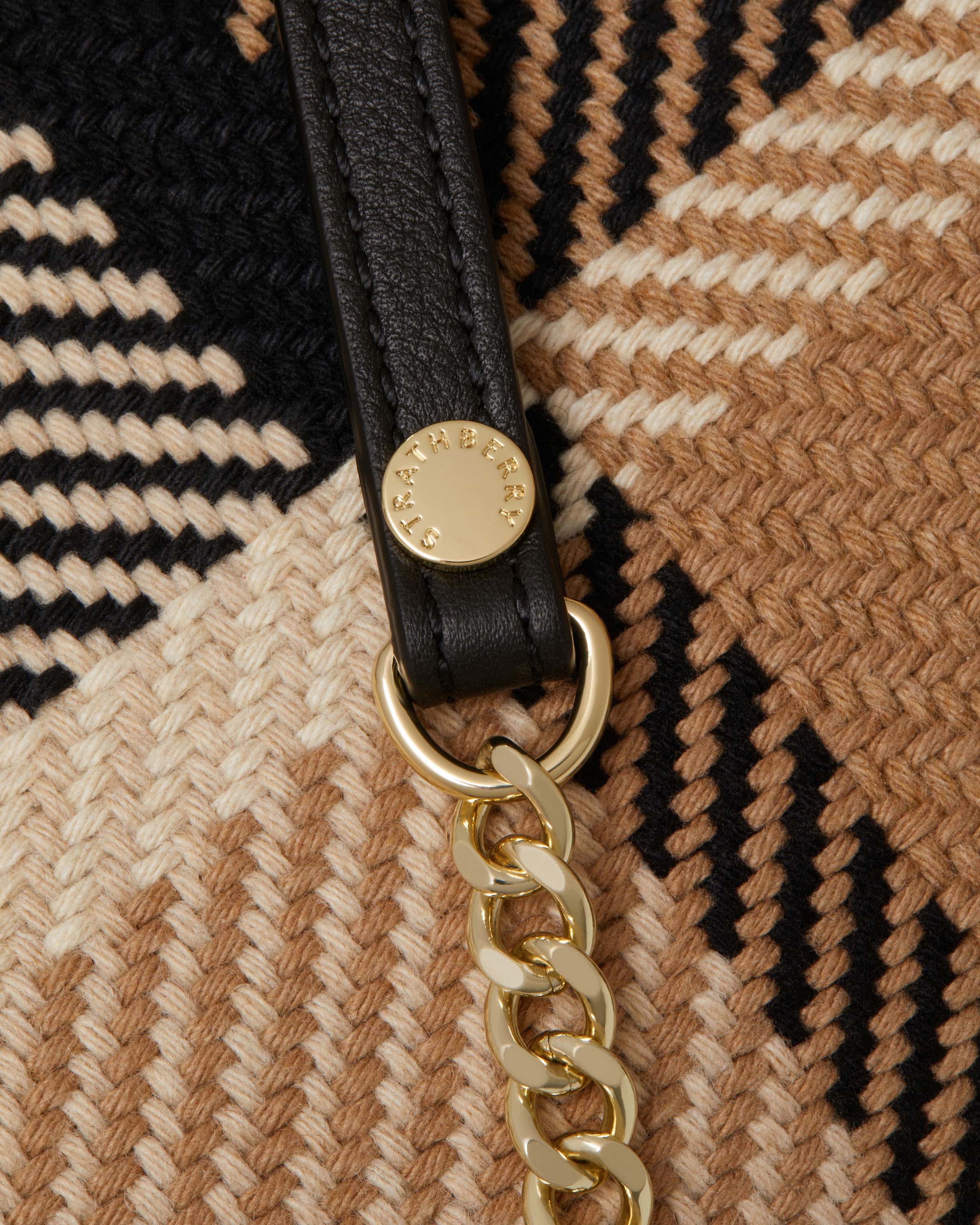 A close up of a key chain on a blanket