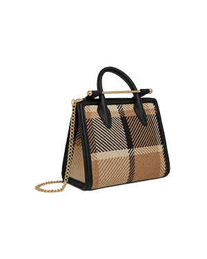 A brown and black handbag with a checkered pattern