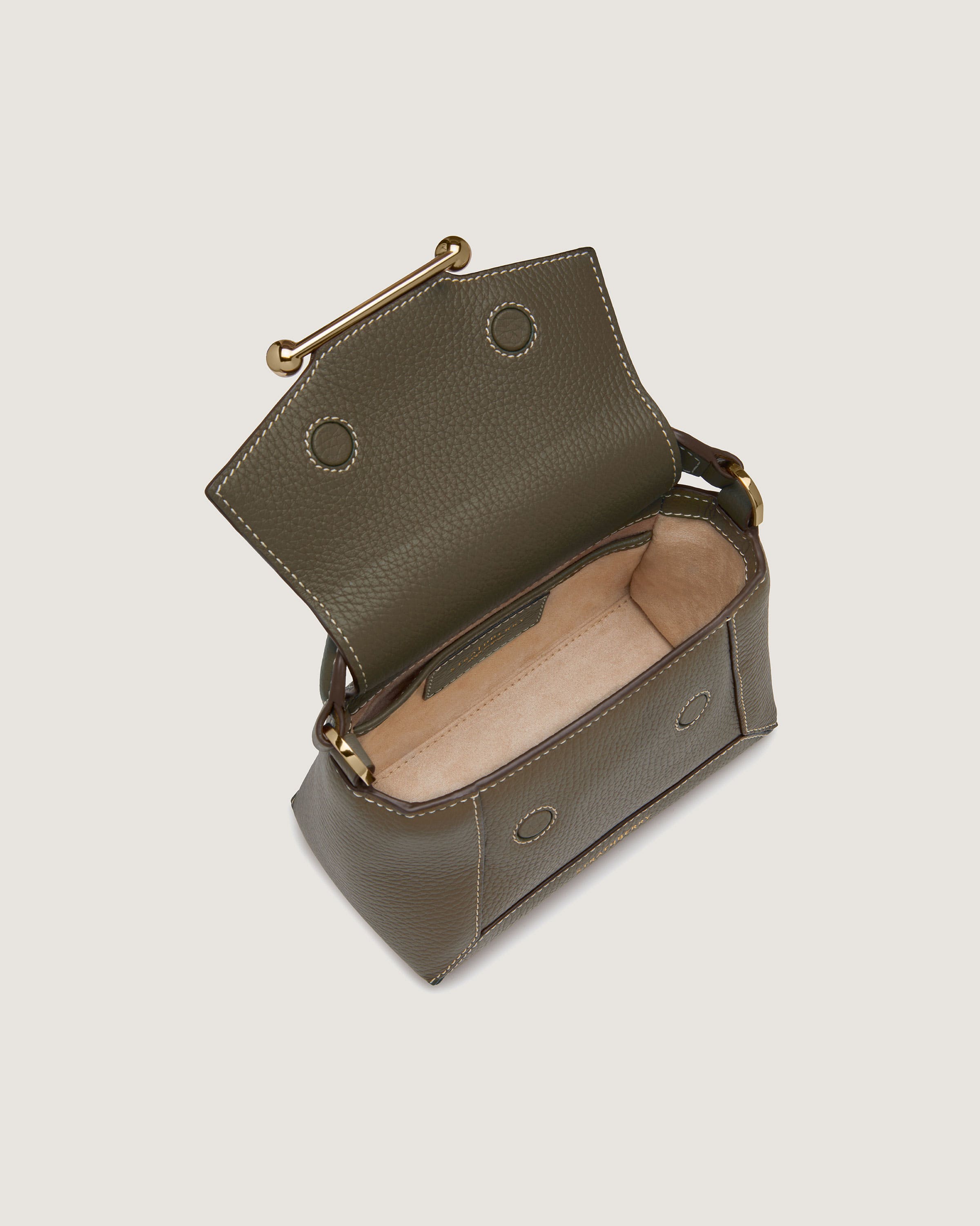 A green leather purse with a gold handle