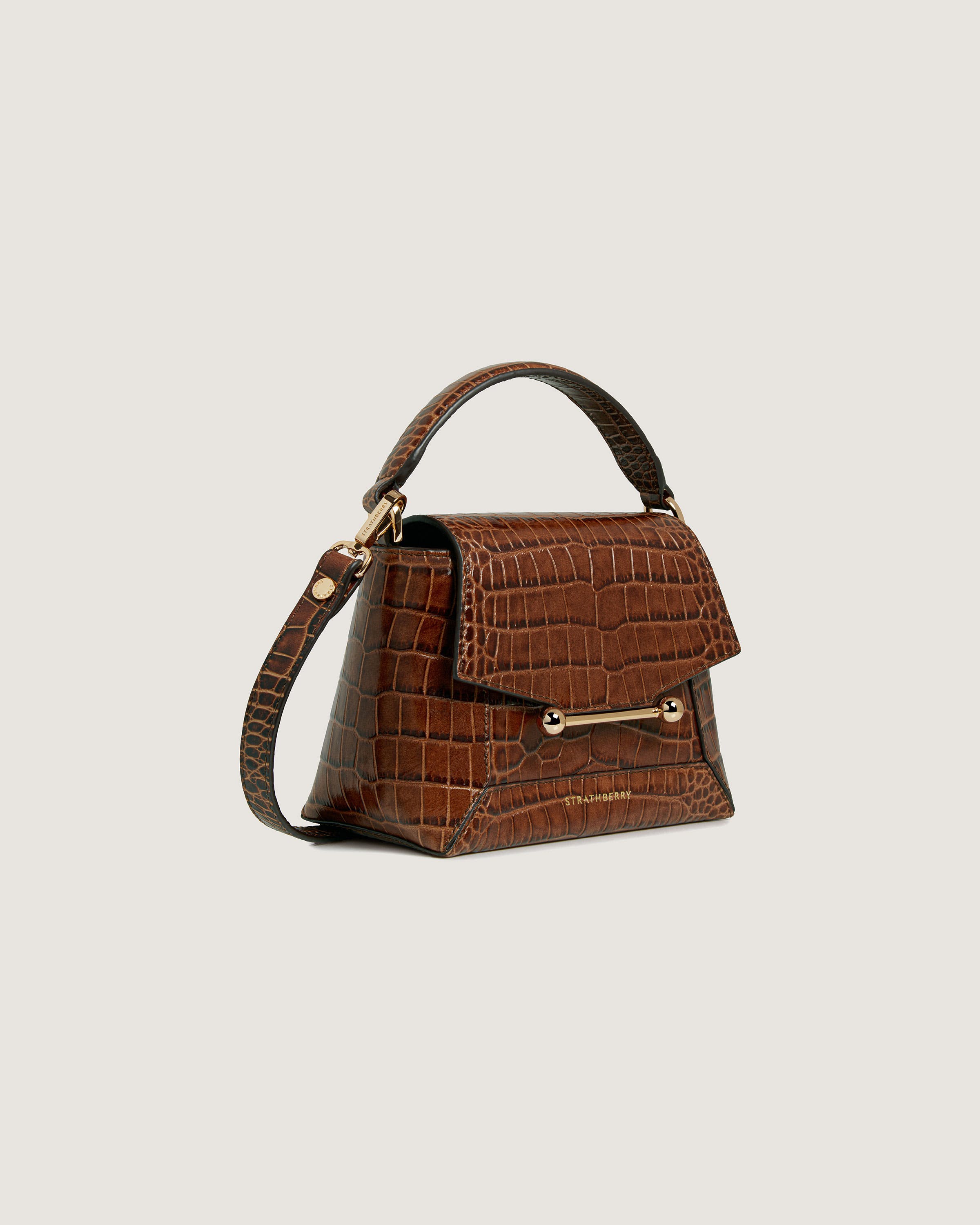 A brown handbag on a white background