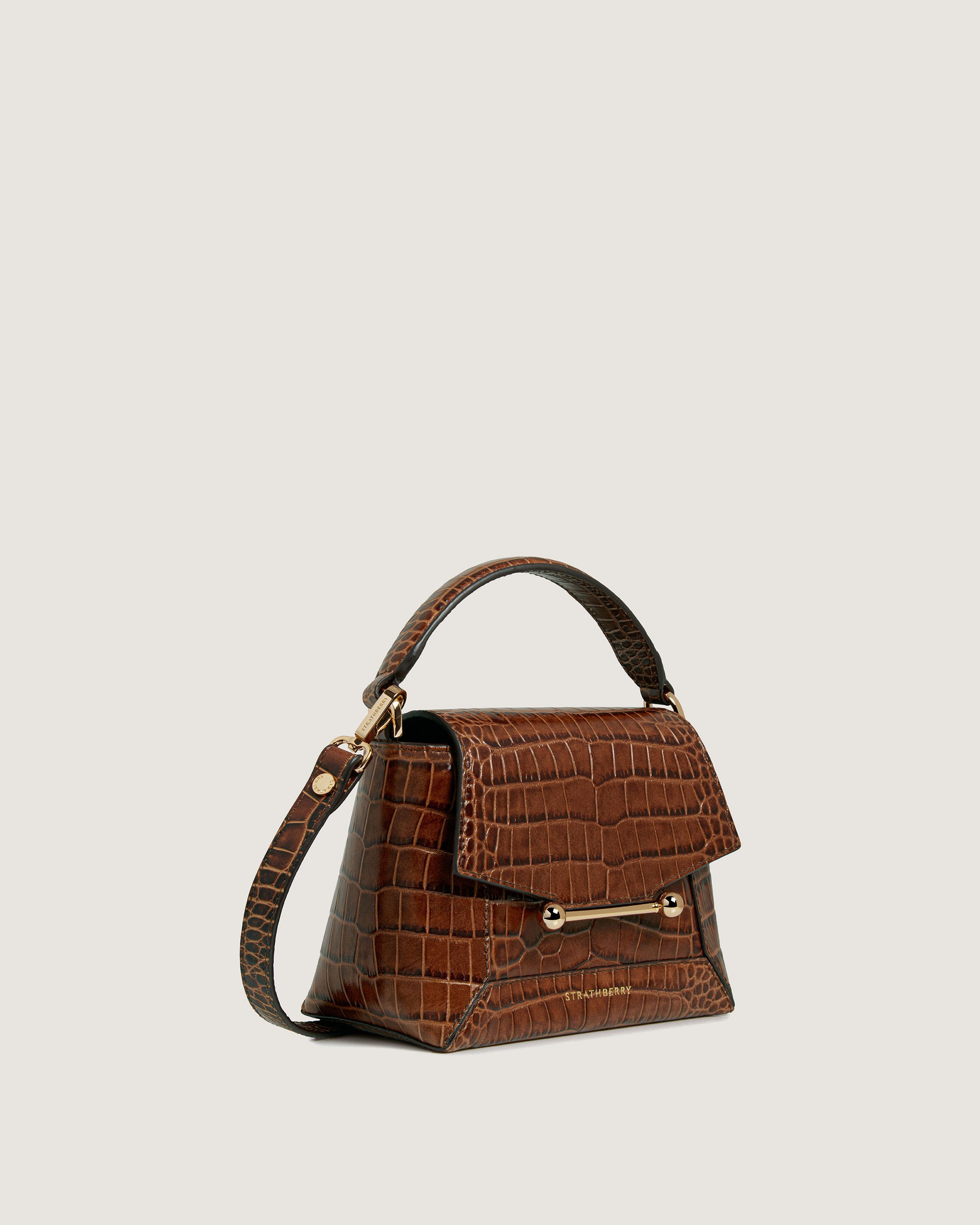 A brown handbag on a white background