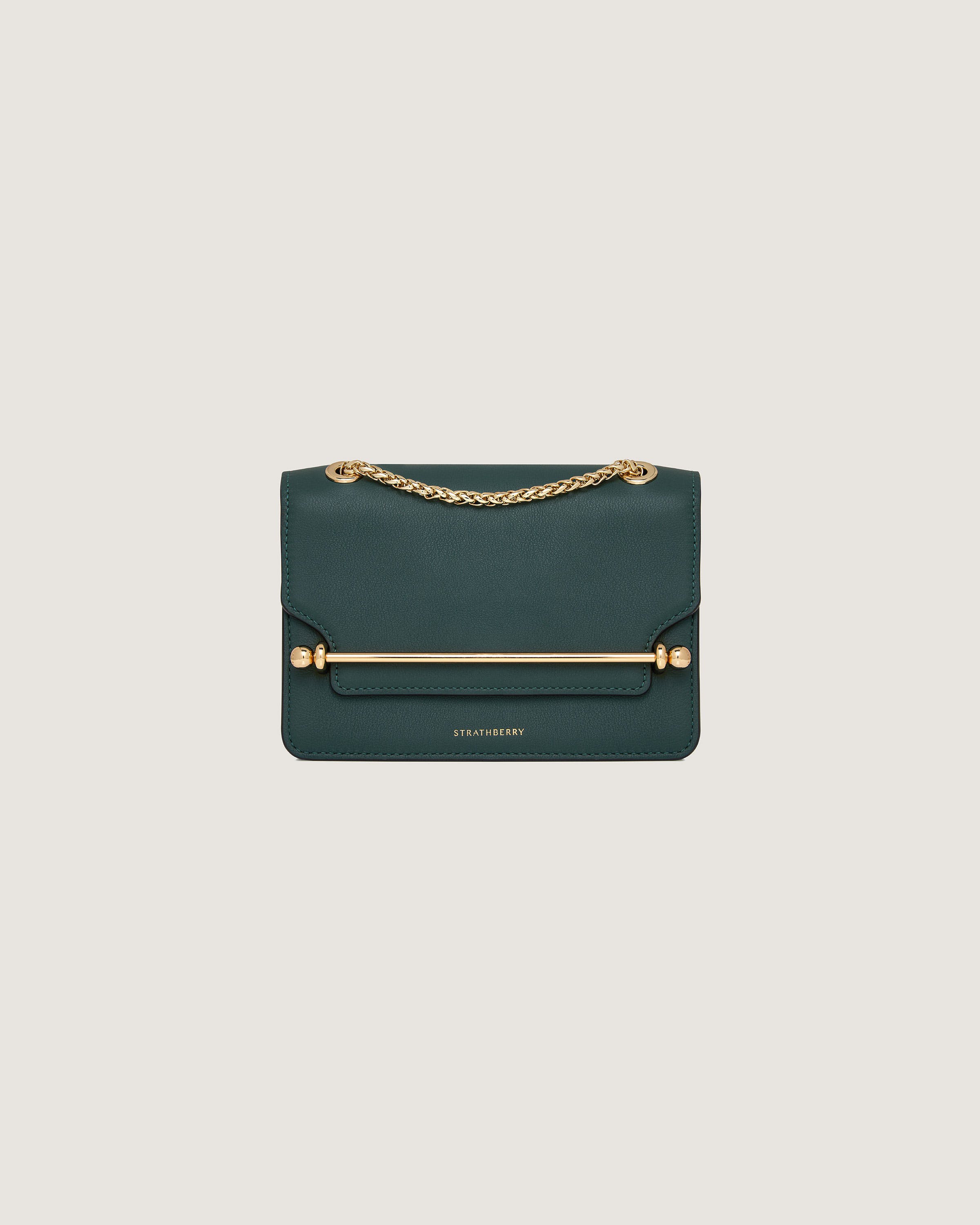 A green leather bag with a gold chain strap