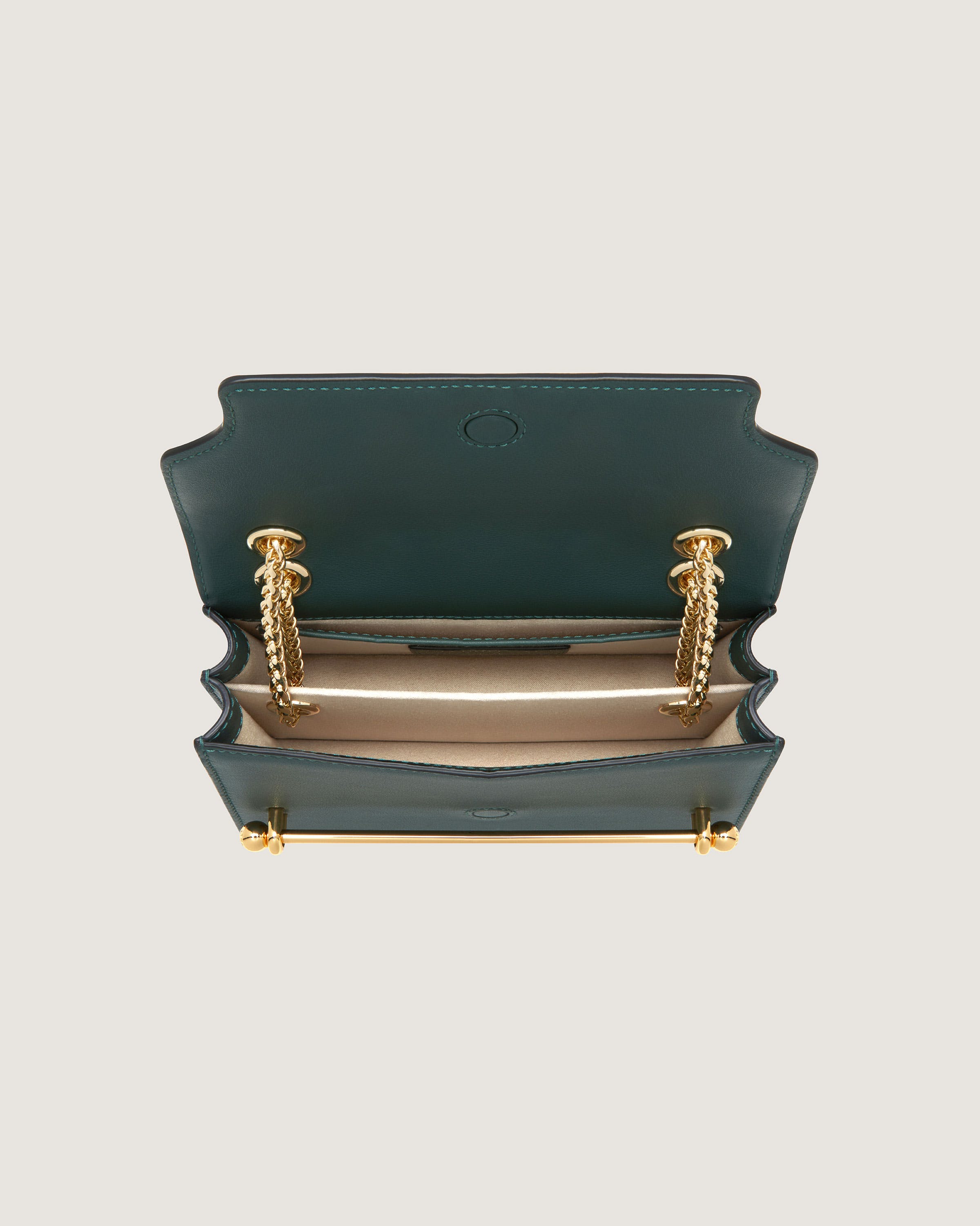 A green and gold purse on a white background