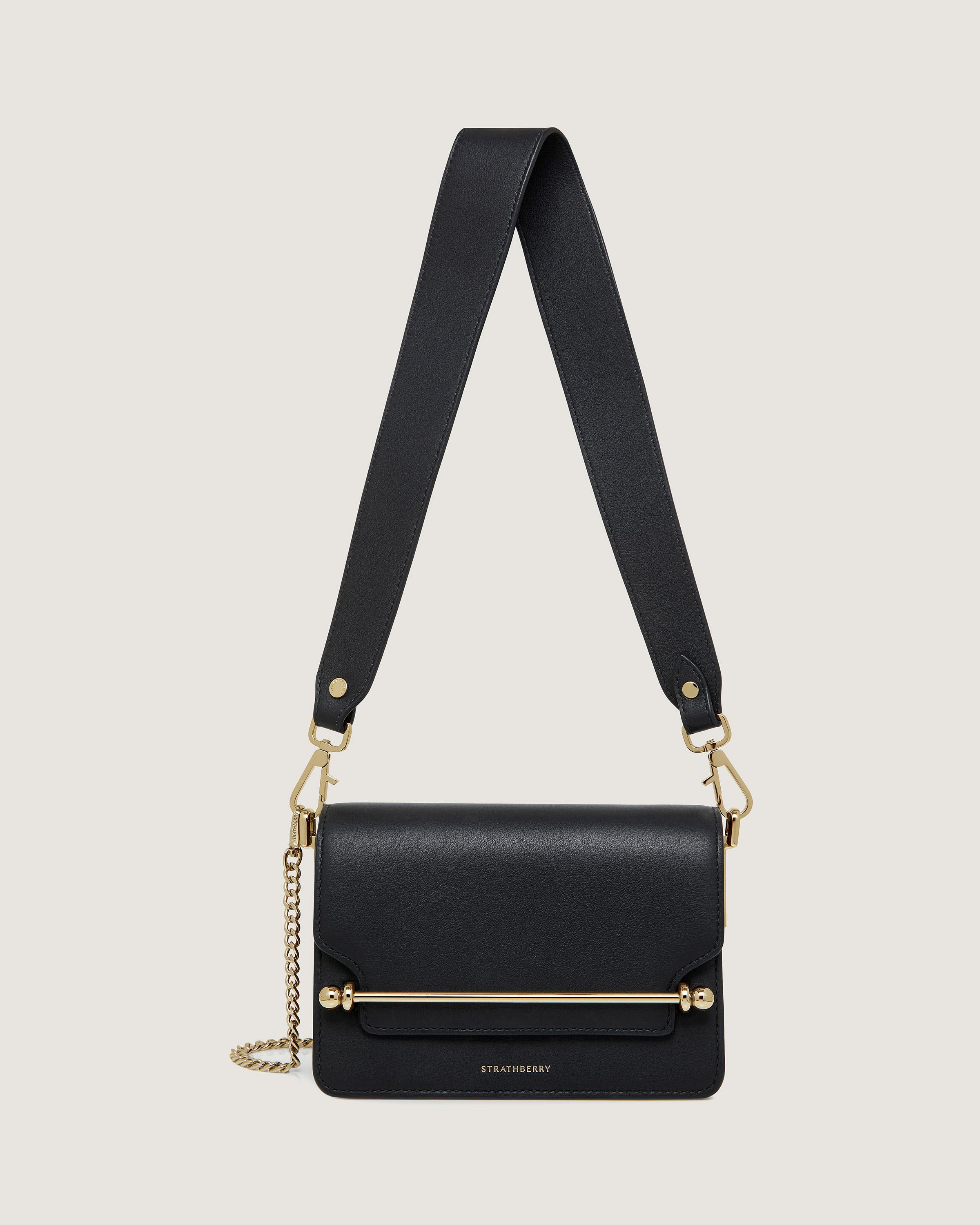 A black cross body bag with a chain strap