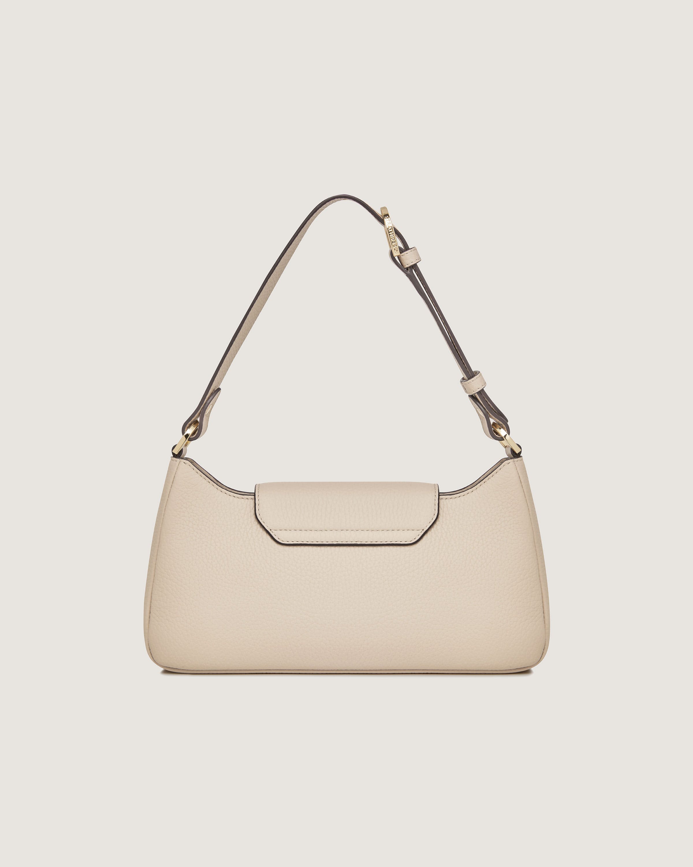 A white purse with a long strap