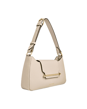 A white handbag with a gold handle