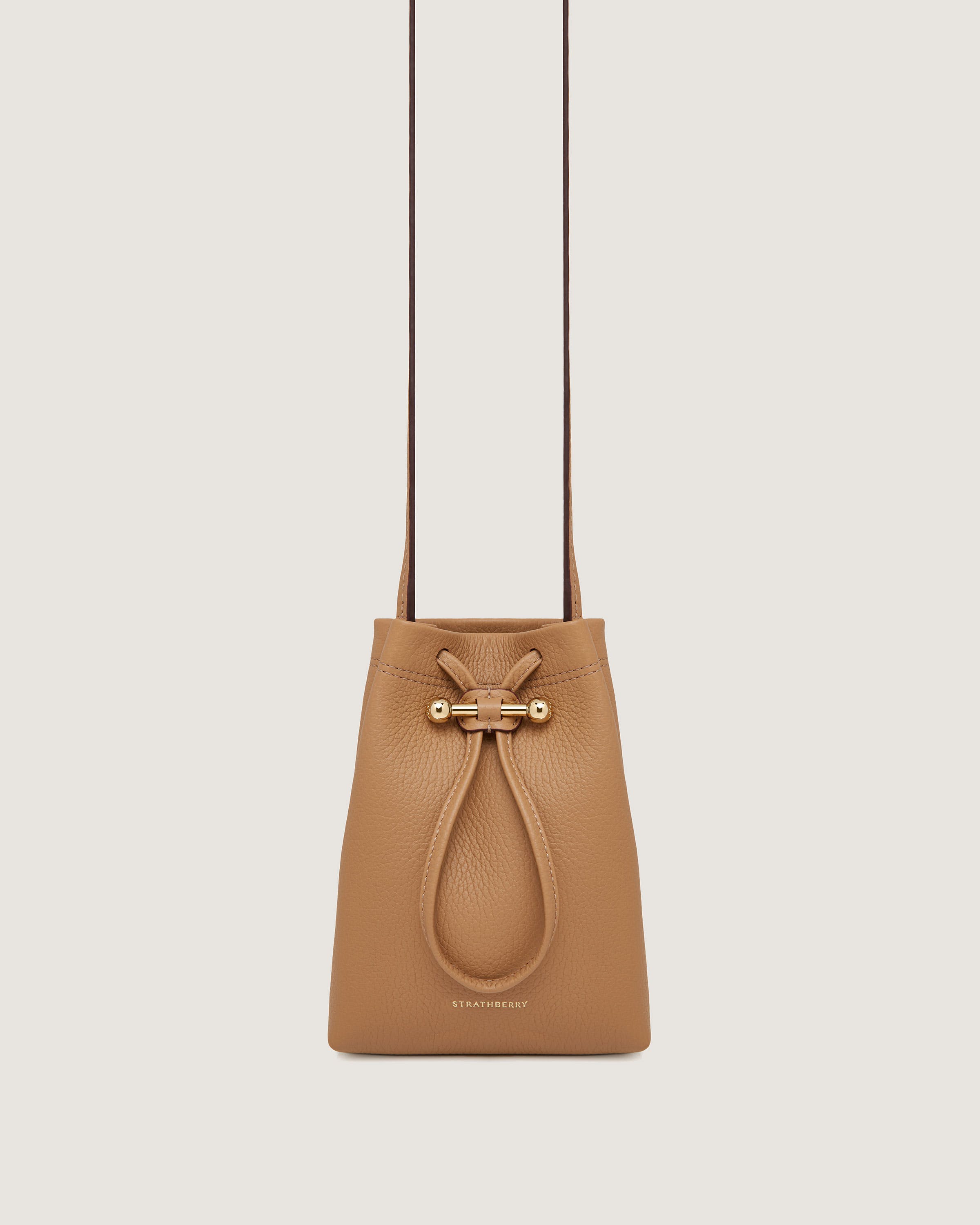 A tan leather handbag with a handle