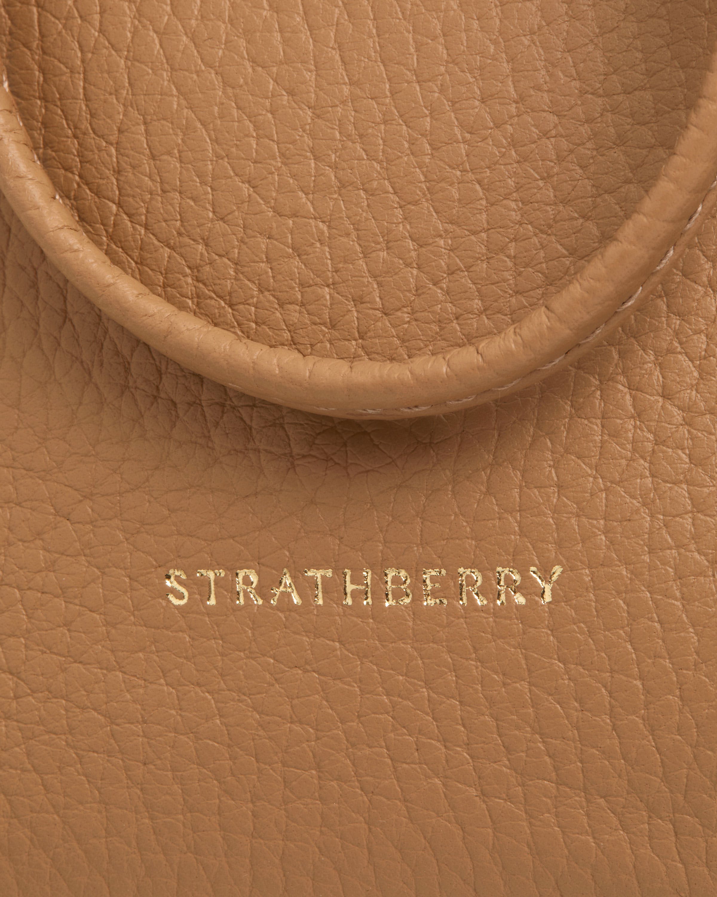 A close up of a brown leather bag