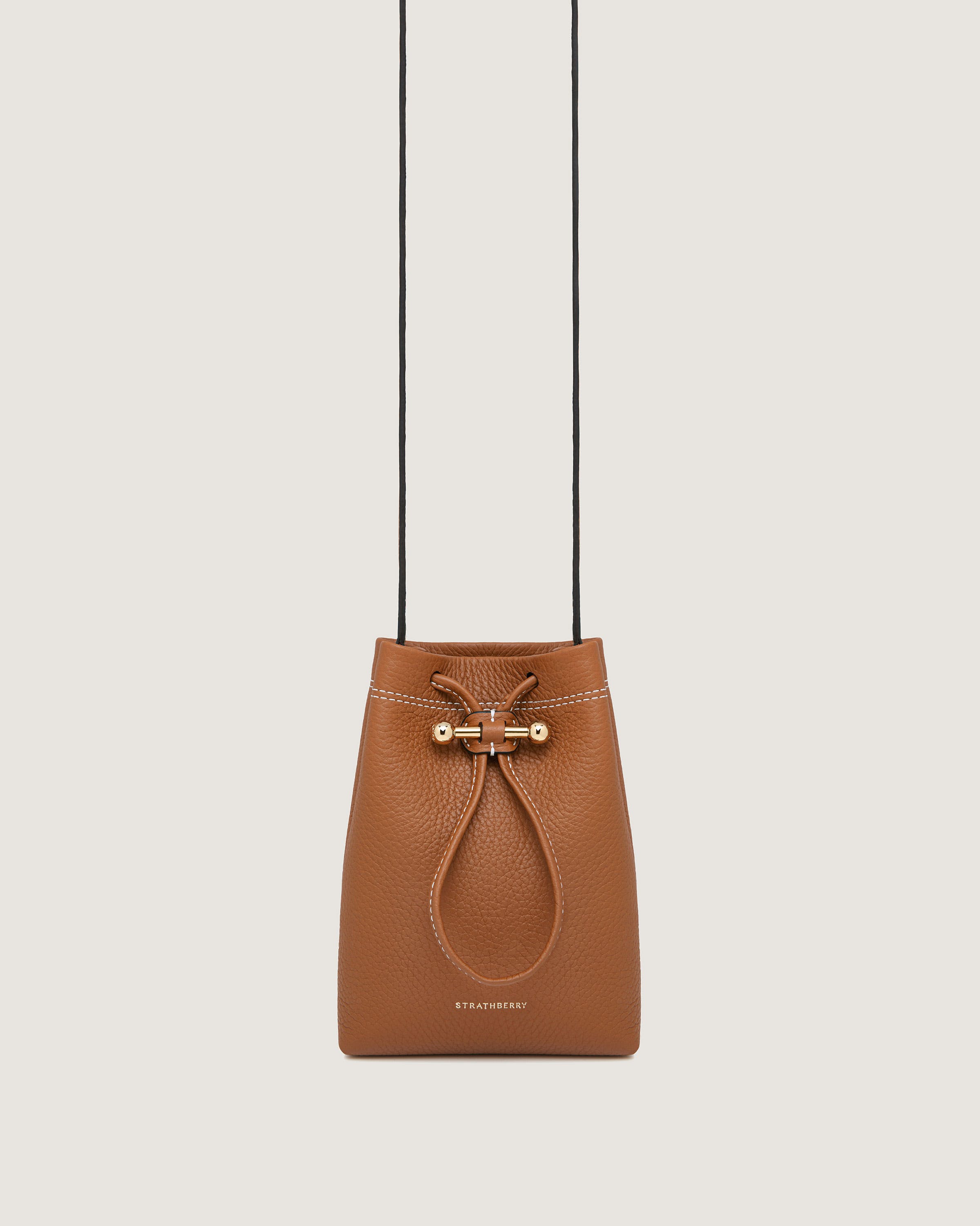 A brown purse hanging from a string