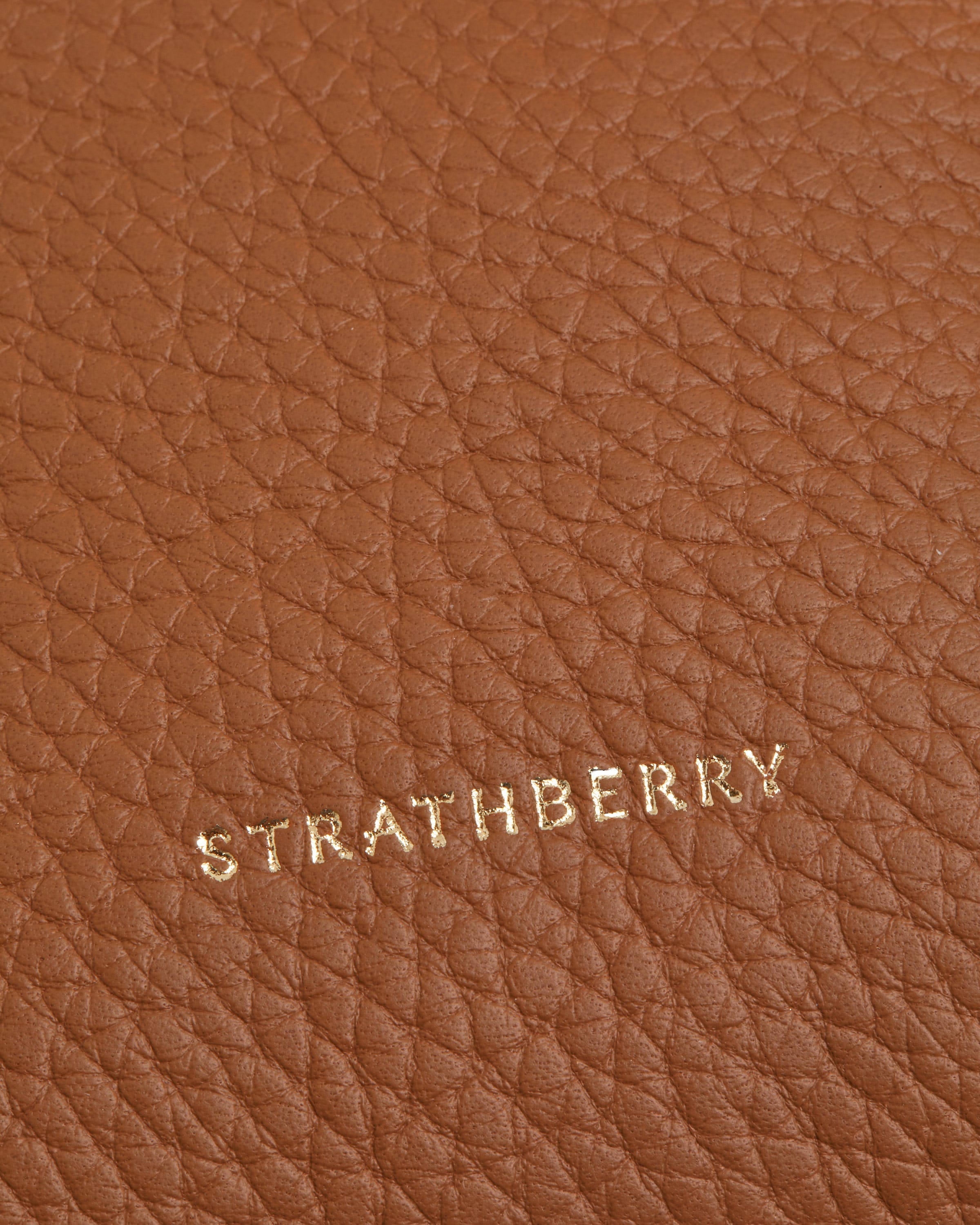 A close up of a brown leather surface