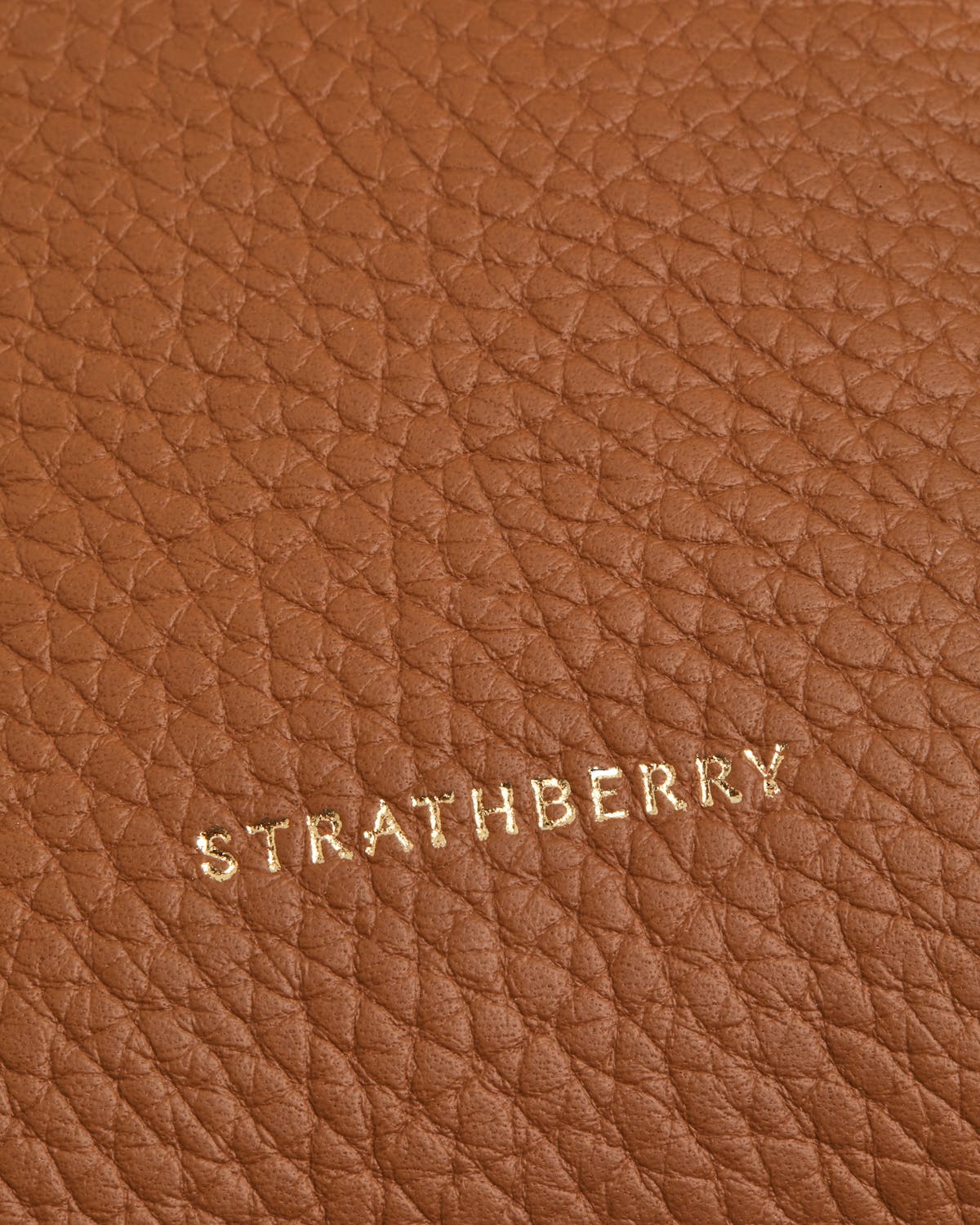 A close up of a brown leather surface