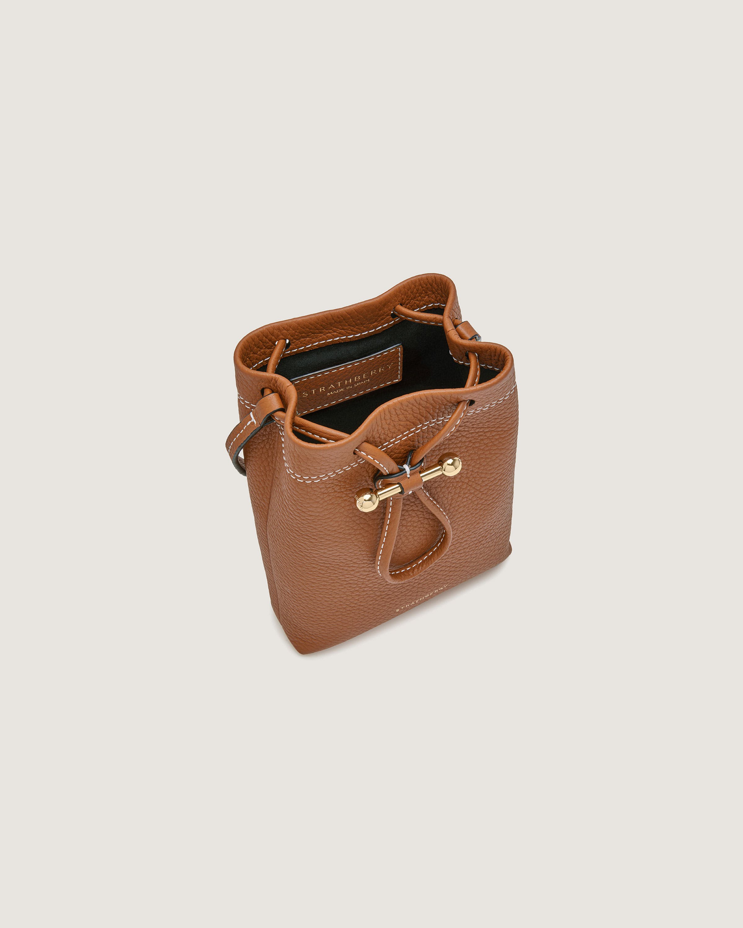 A small brown purse with a handle