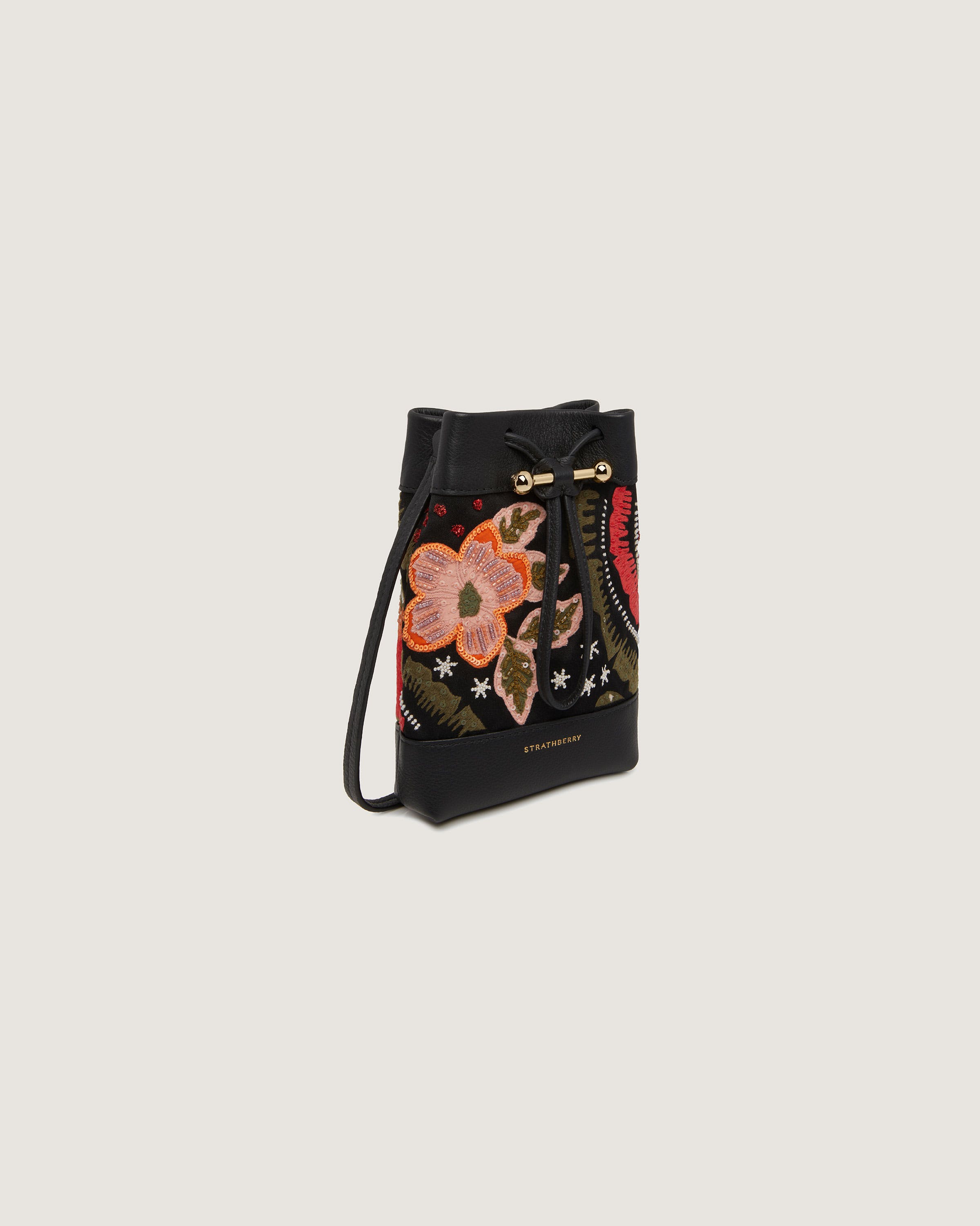 A small black bag with flowers on it