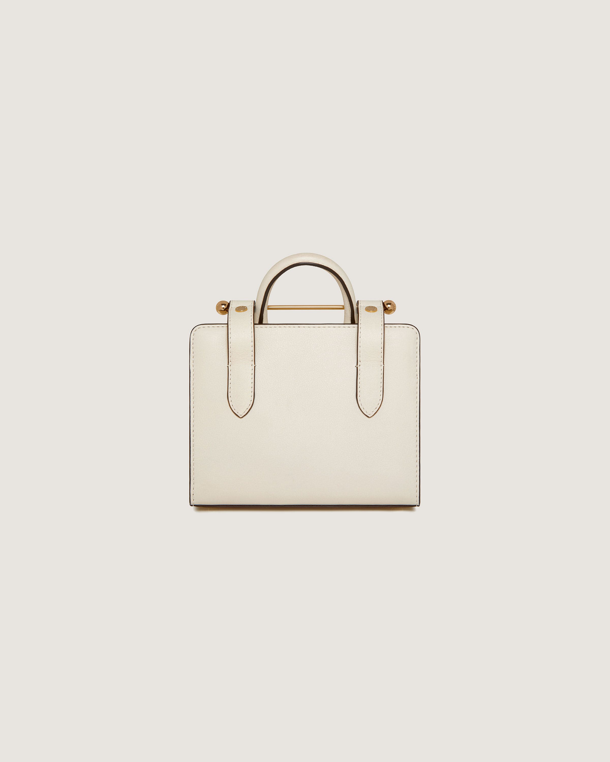 A white handbag with a handle on a white background