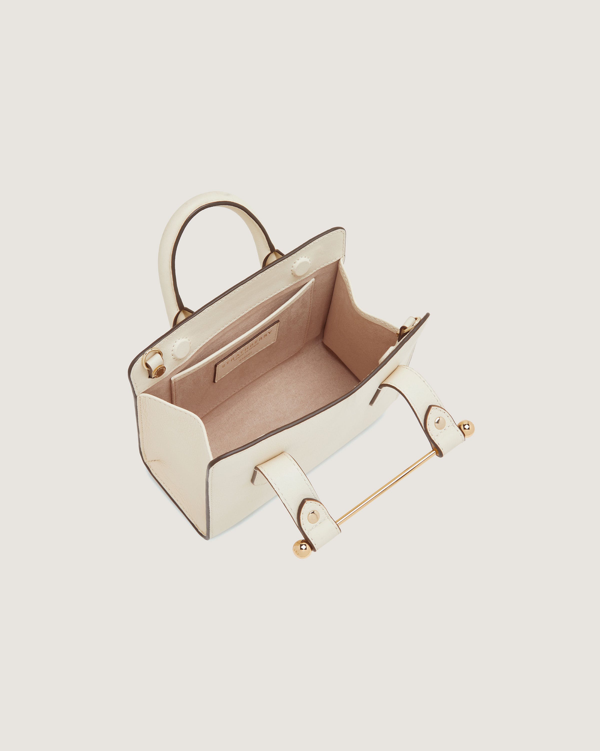 A small white purse with a handle