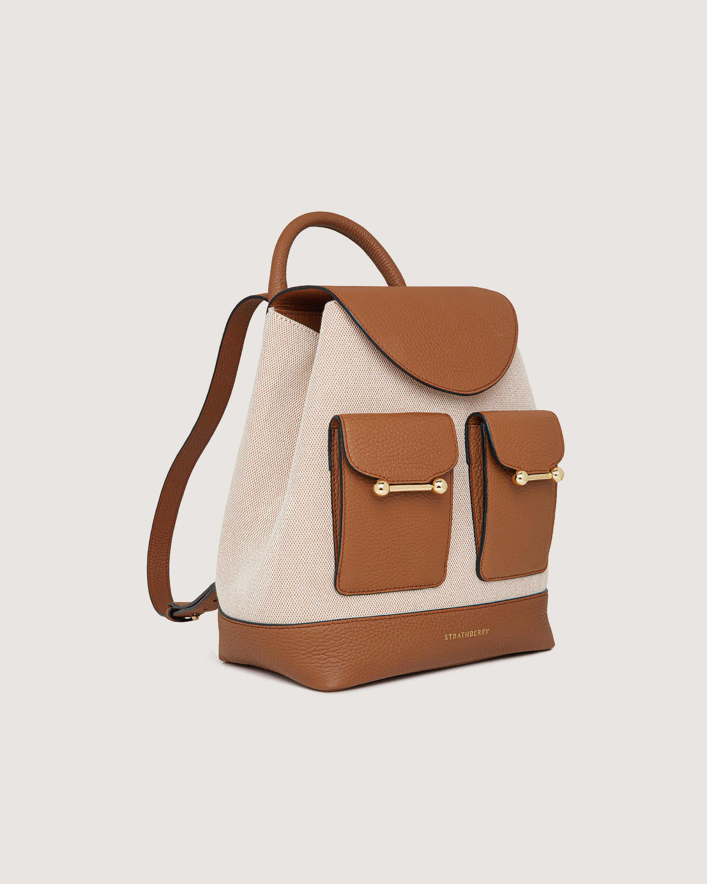 A brown and white handbag with two pockets