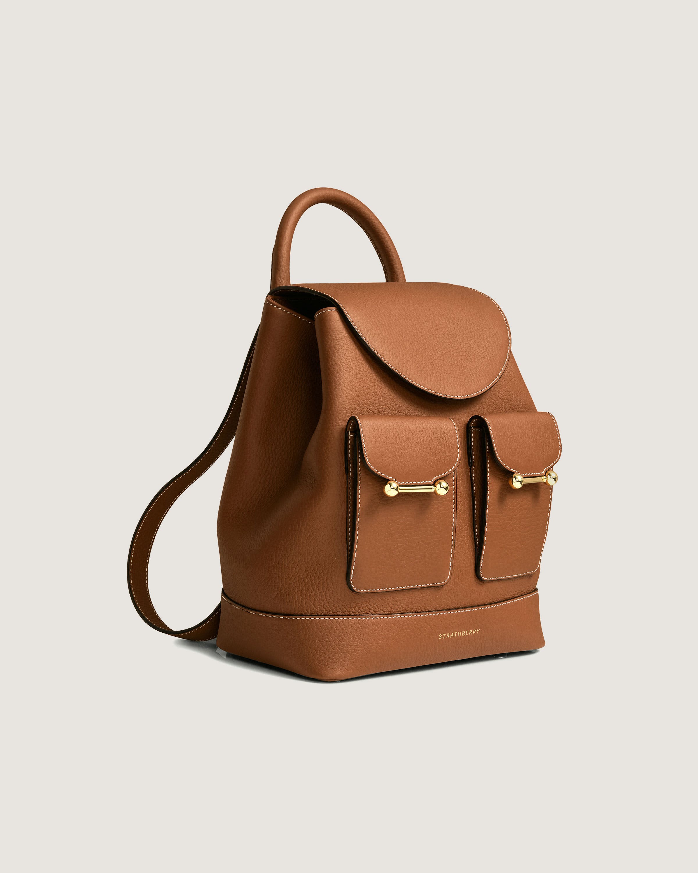 A brown leather backpack with two compartments