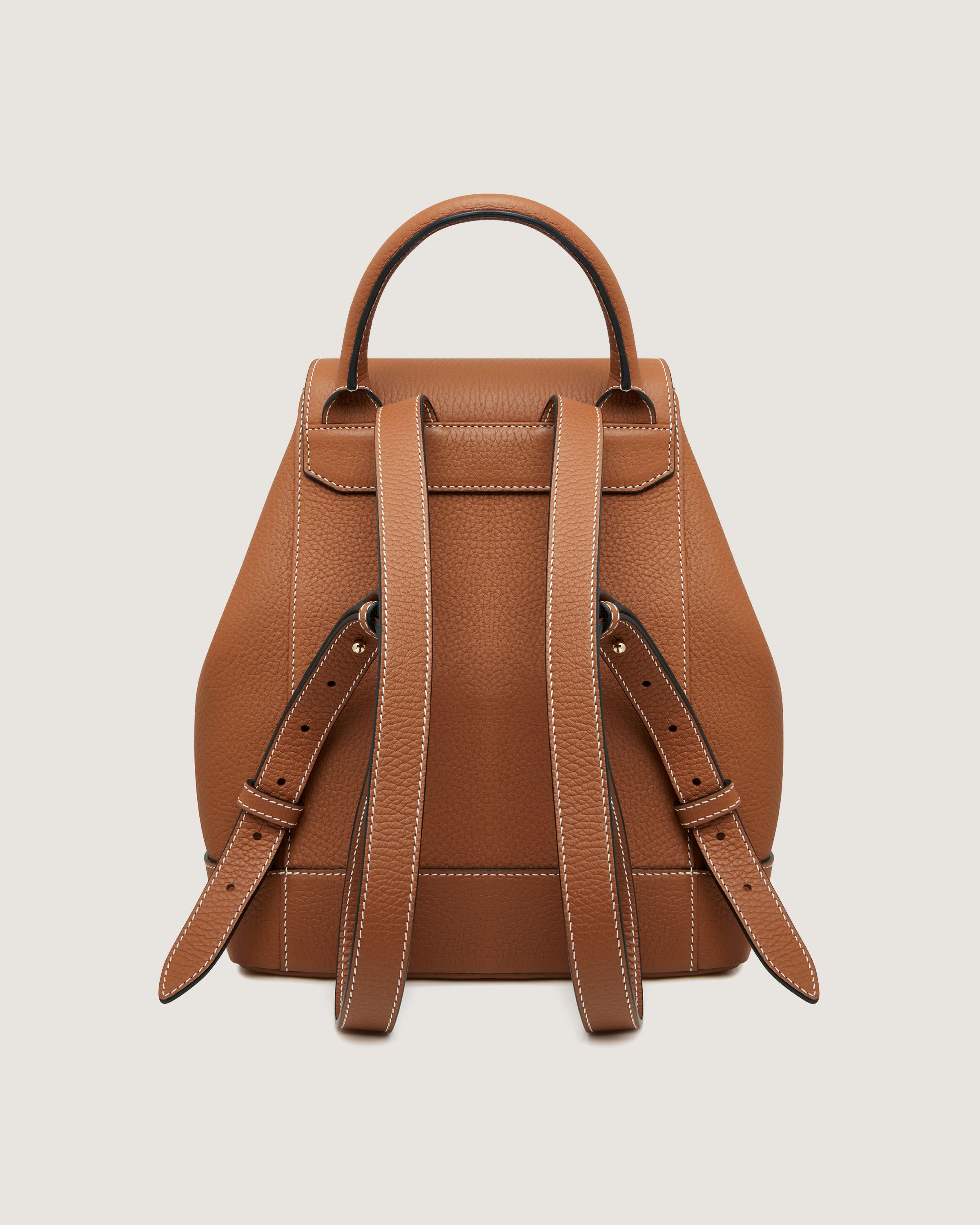 A tan leather backpack with straps